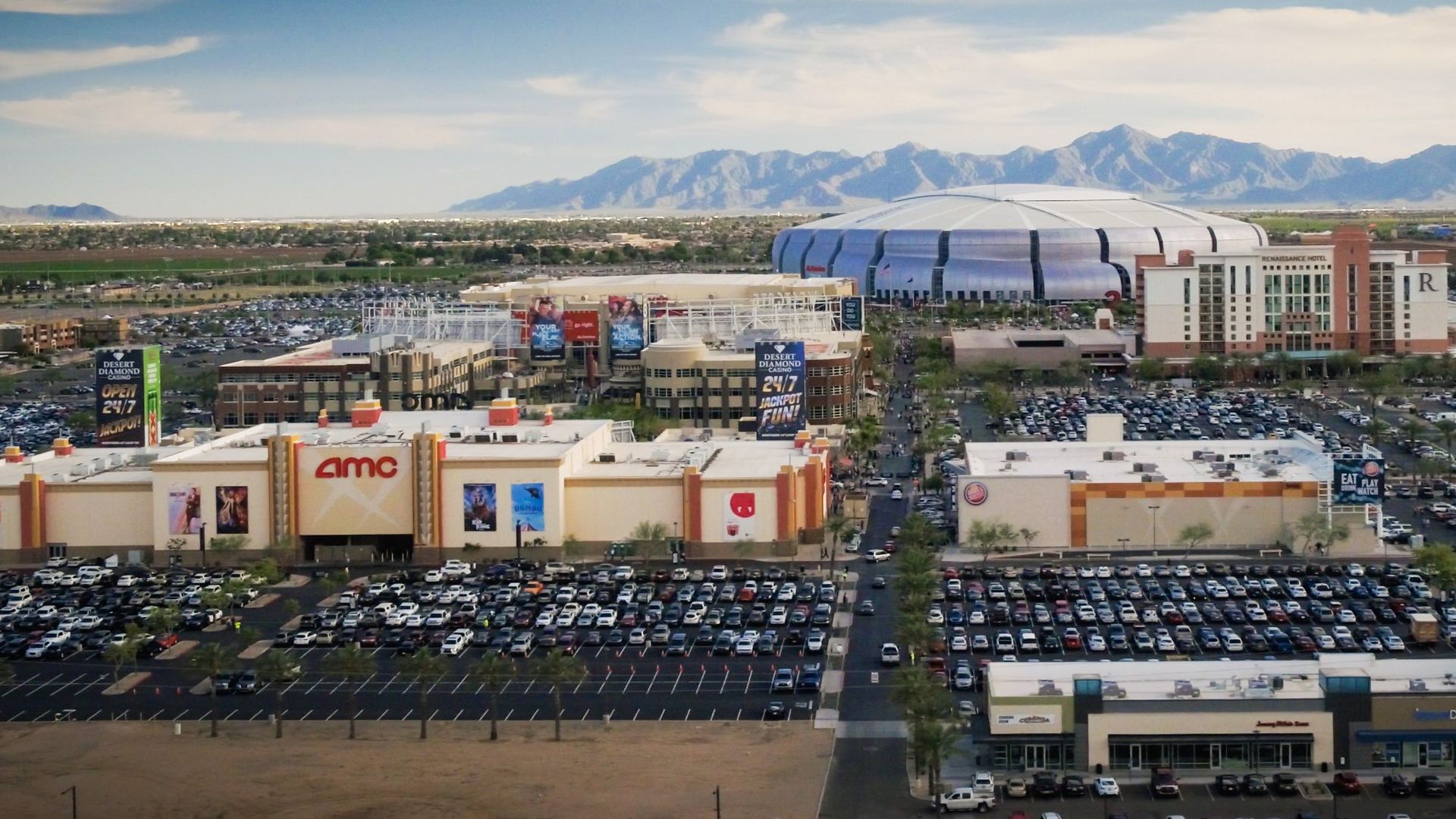 A photo of a football arena and shopping mall. 