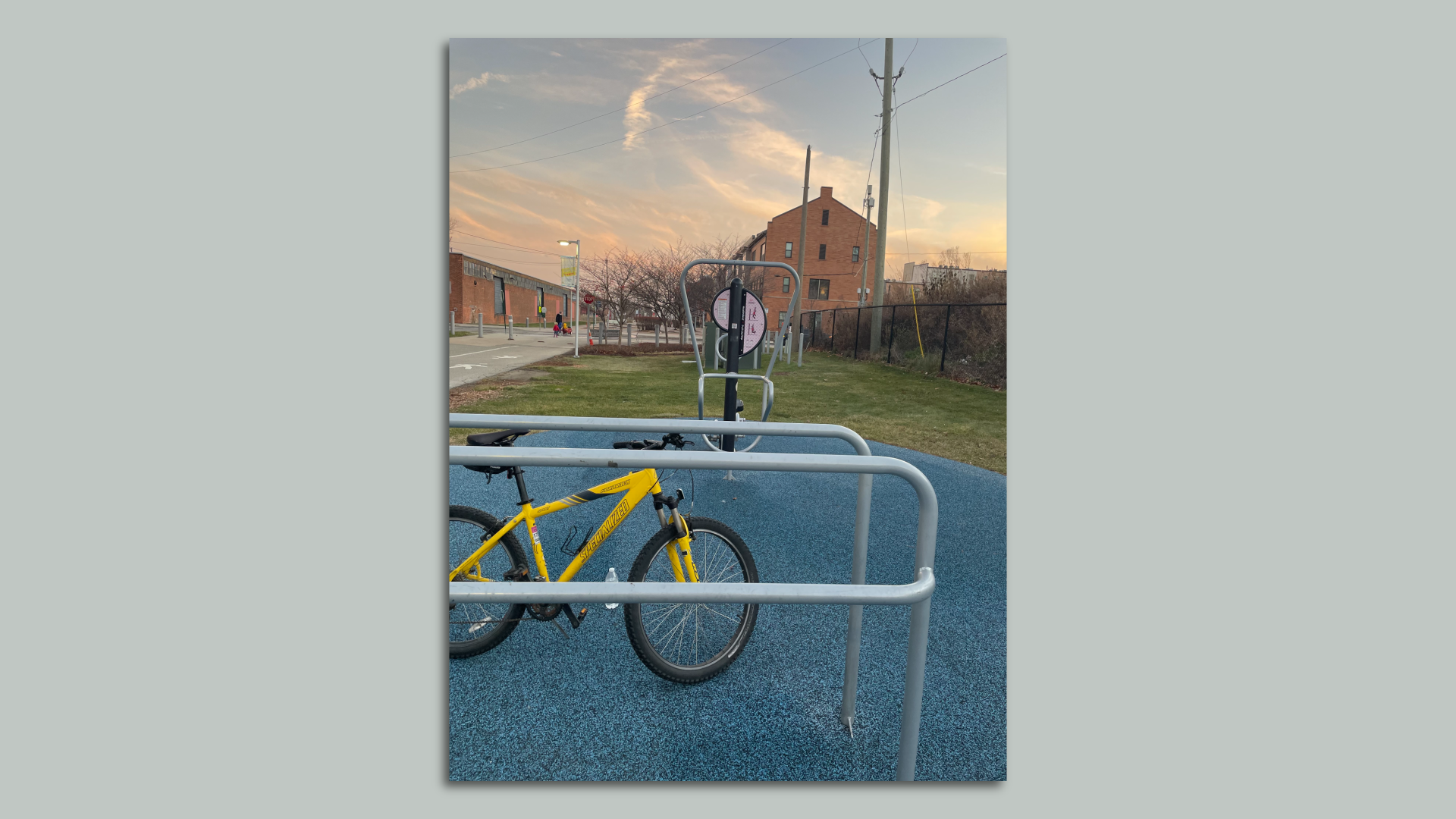 Yellow specialized bike on a bike rack