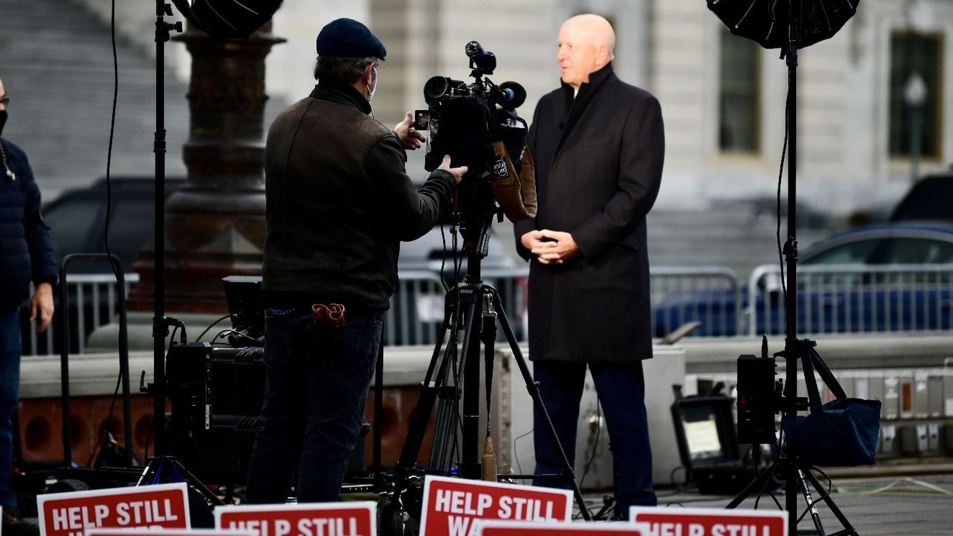 David Solomon stands in a black suit jacket