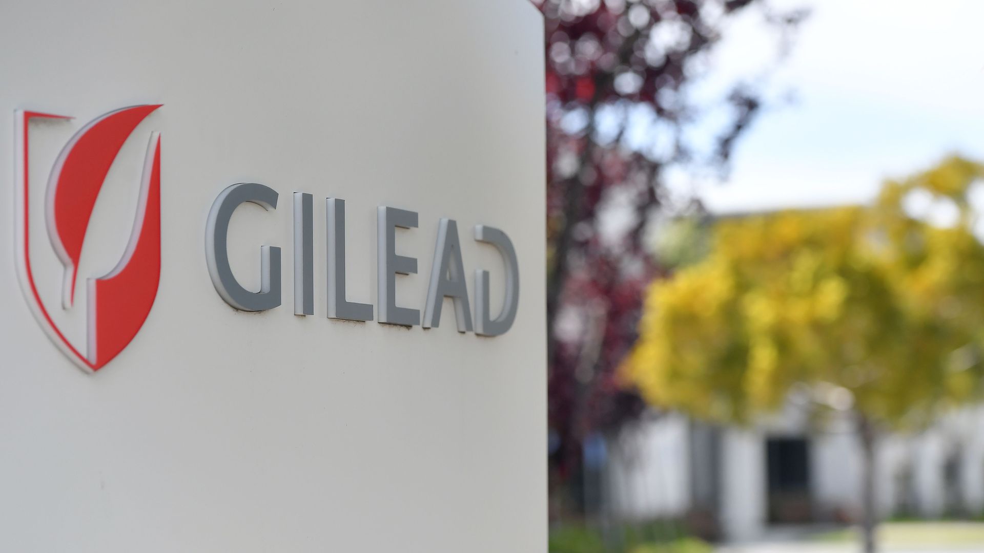 Photo of a white sign that shows the red Gilead logo and name