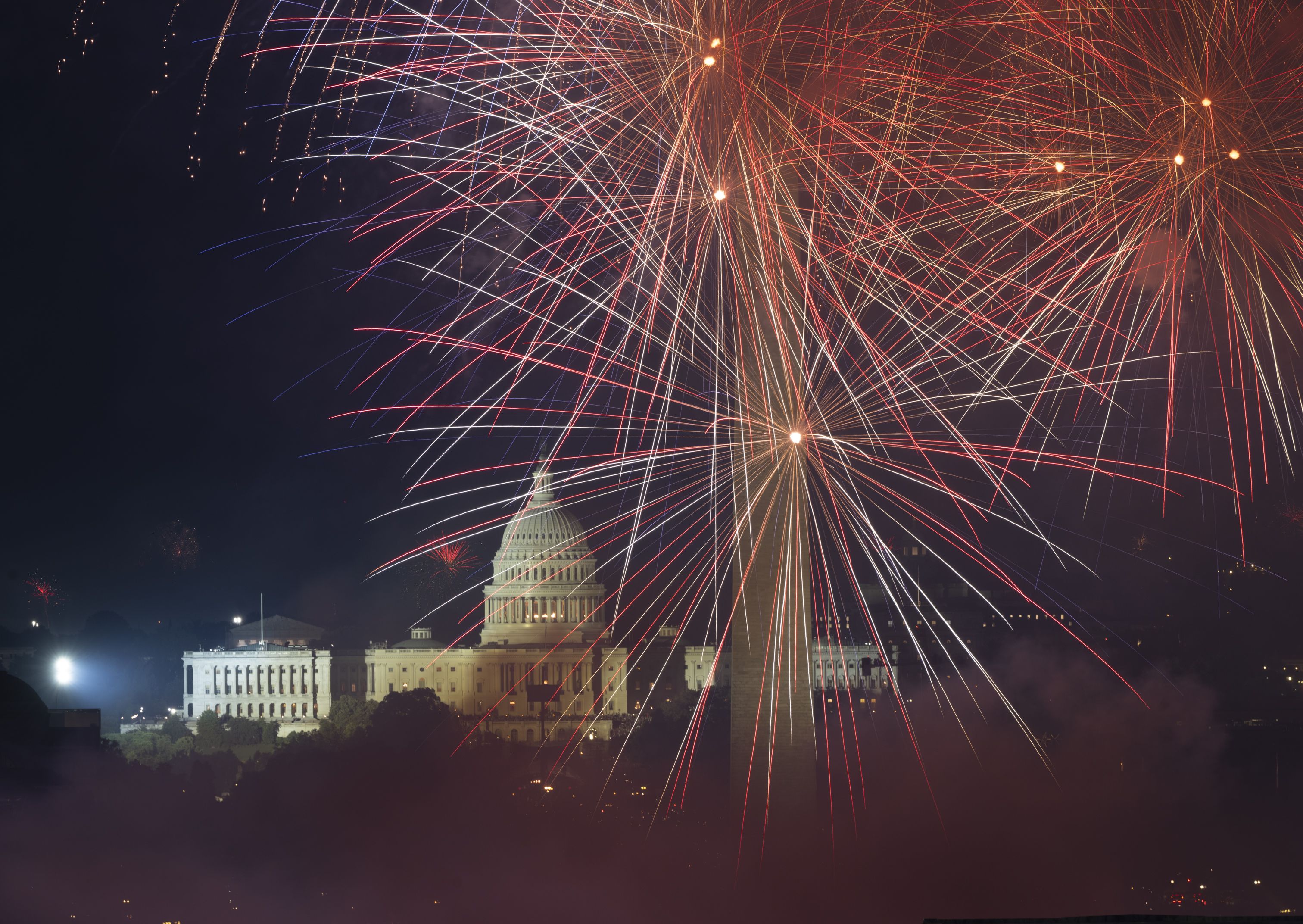  Fireworks illuminate the sky over the National Mall. These photographs are taken from the event venue Top of The Town, where people annually host a private event to observe the fireworks in Arlington,Virginia on July 04, 2025. (Photo by Marvin Joseph/The Washington Post via Getty Images)