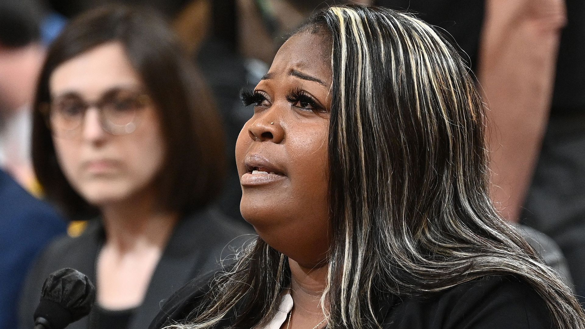 Photo of Wandrea Shaye Moss speaking
