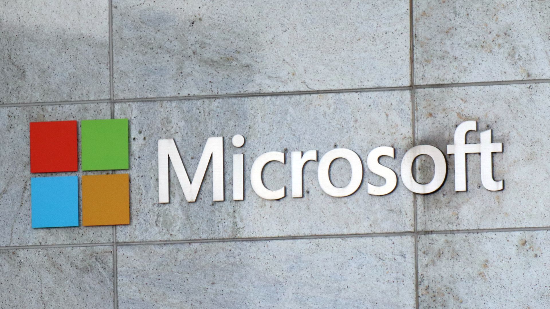 A photo of a Microsoft sign outside an office building