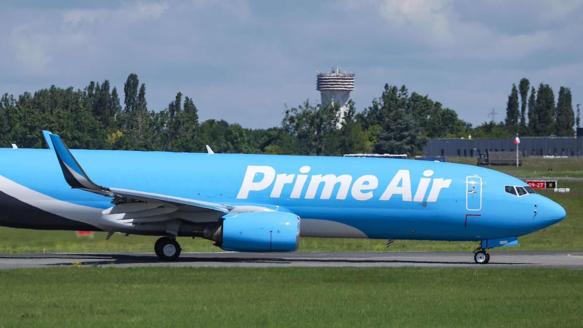 Picture of a bright blue plane with the words "Prime Air" written on the side