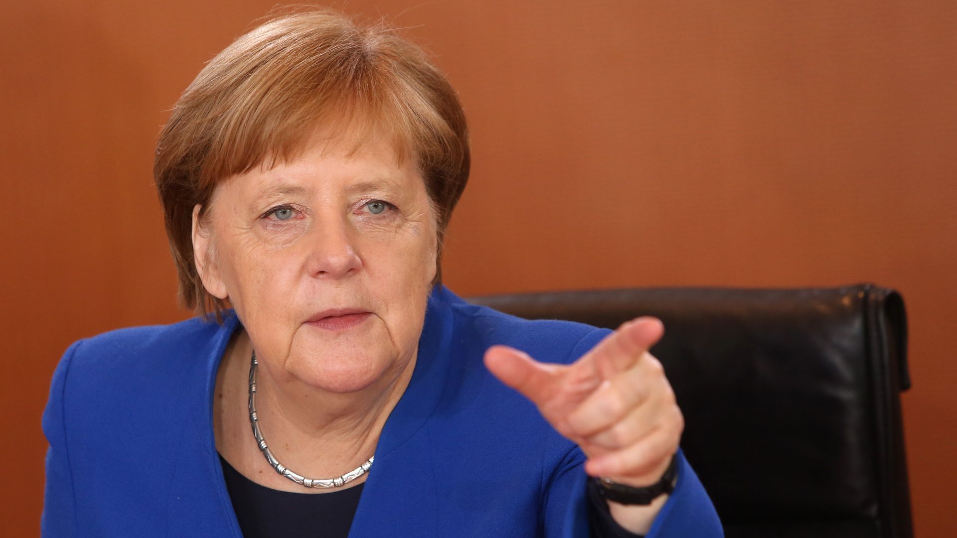 Angela Merkel speaking and gesturing