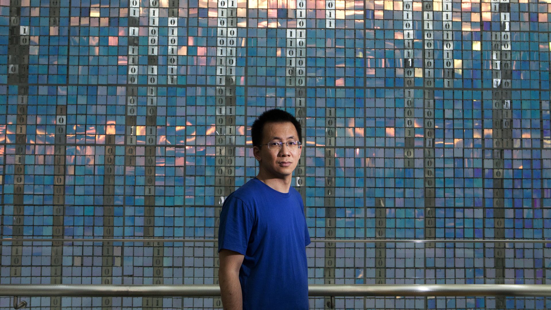 Zhang Yiming, founder of Beijing ByteDance Technology, poses in front of a decorative wall at his company