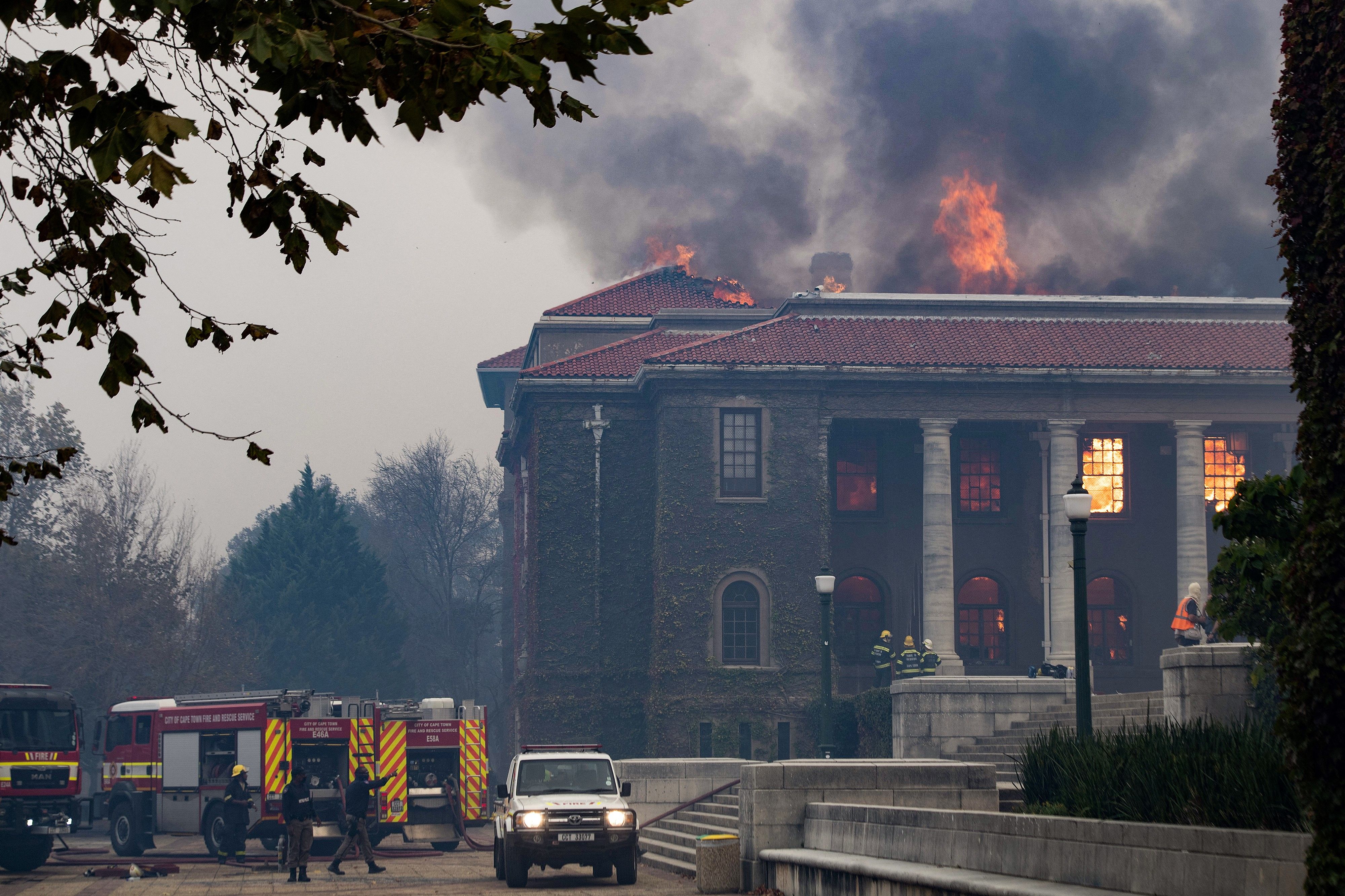 Firefighters try, in vain, to extinguish a fire in the Jagger Library, at the University of Cape Town