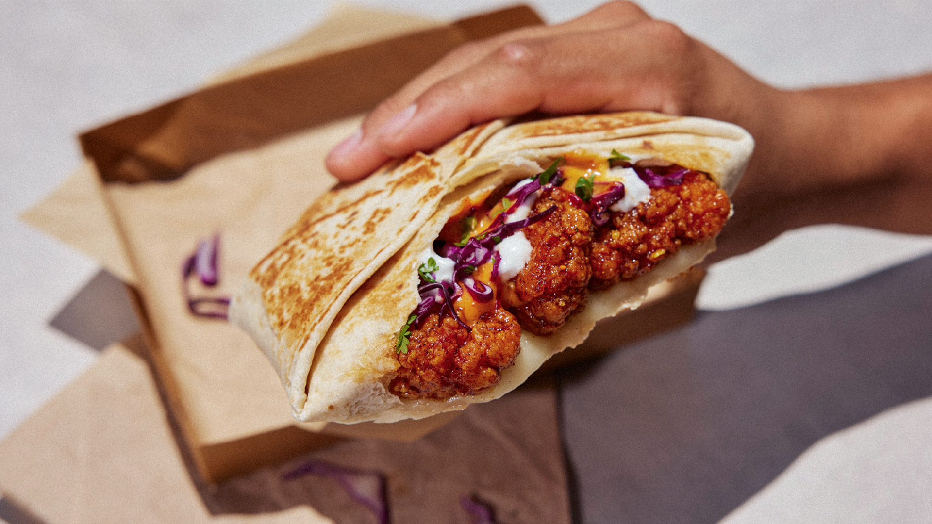 A Crunchwrap Supreme with fried chicken. 