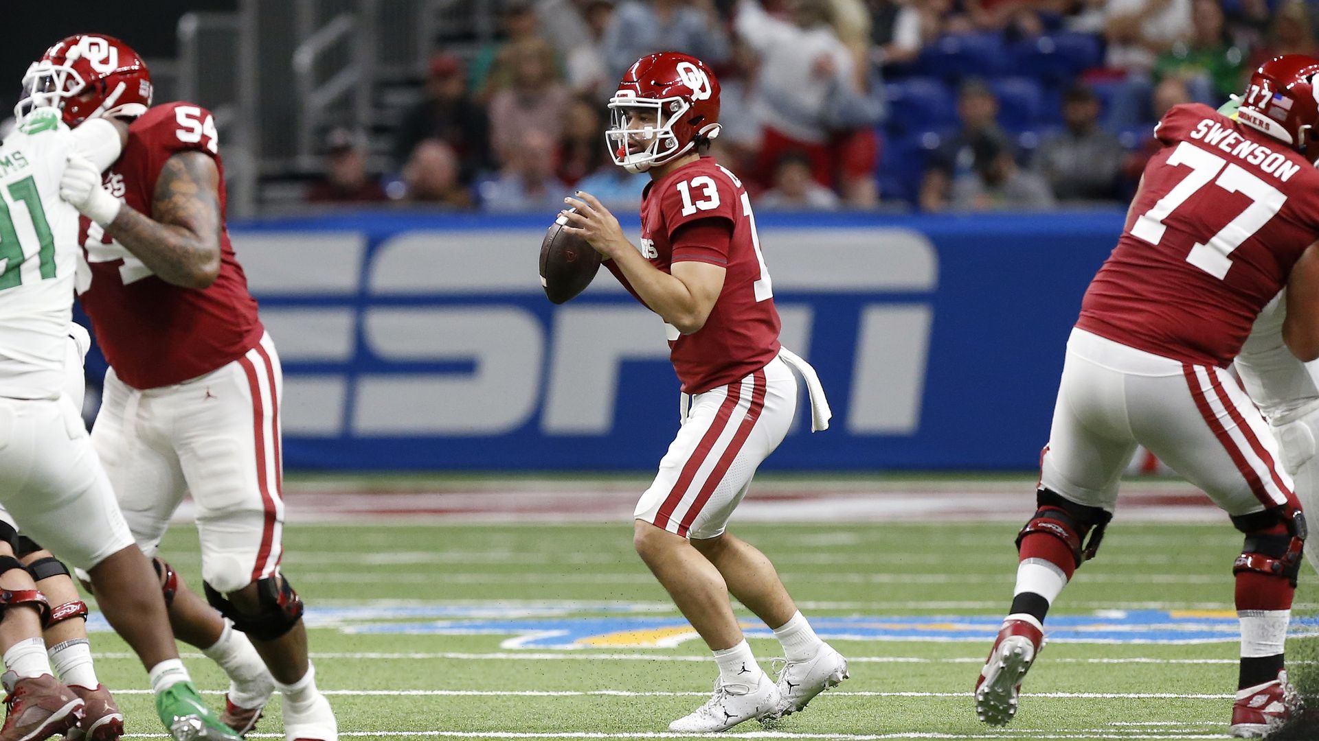 Oklahoma Sooners quarterback Caleb Williams (13) throws the ball off against the Oregon Ducks during the Valero Alamo Bowl football game at the Alamodome on December 29, 2021 in San Antonio, TX.