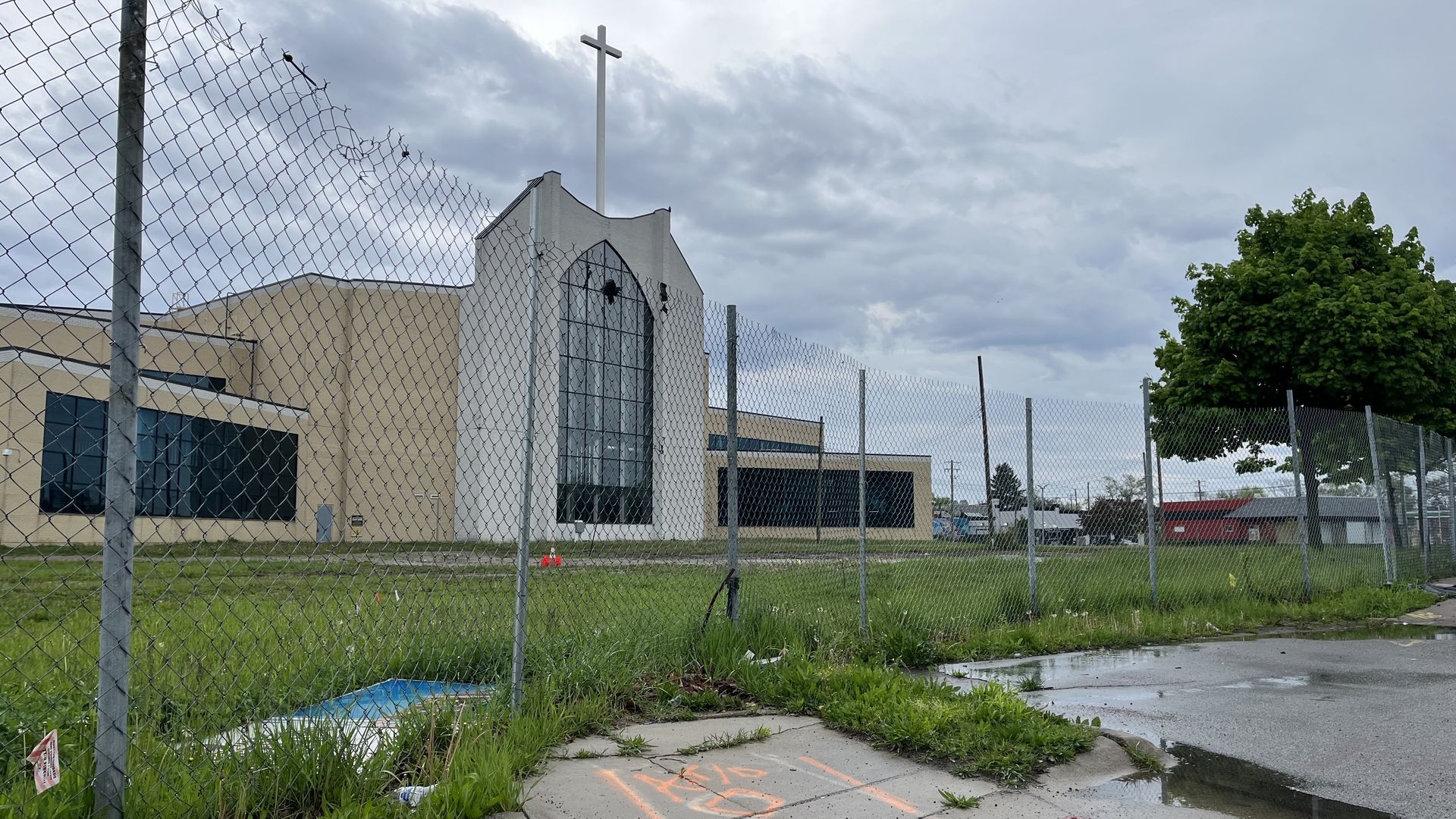 The church behind a big fence. 