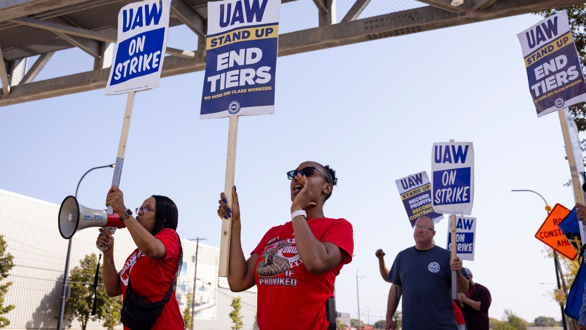 Workers holding picket signs