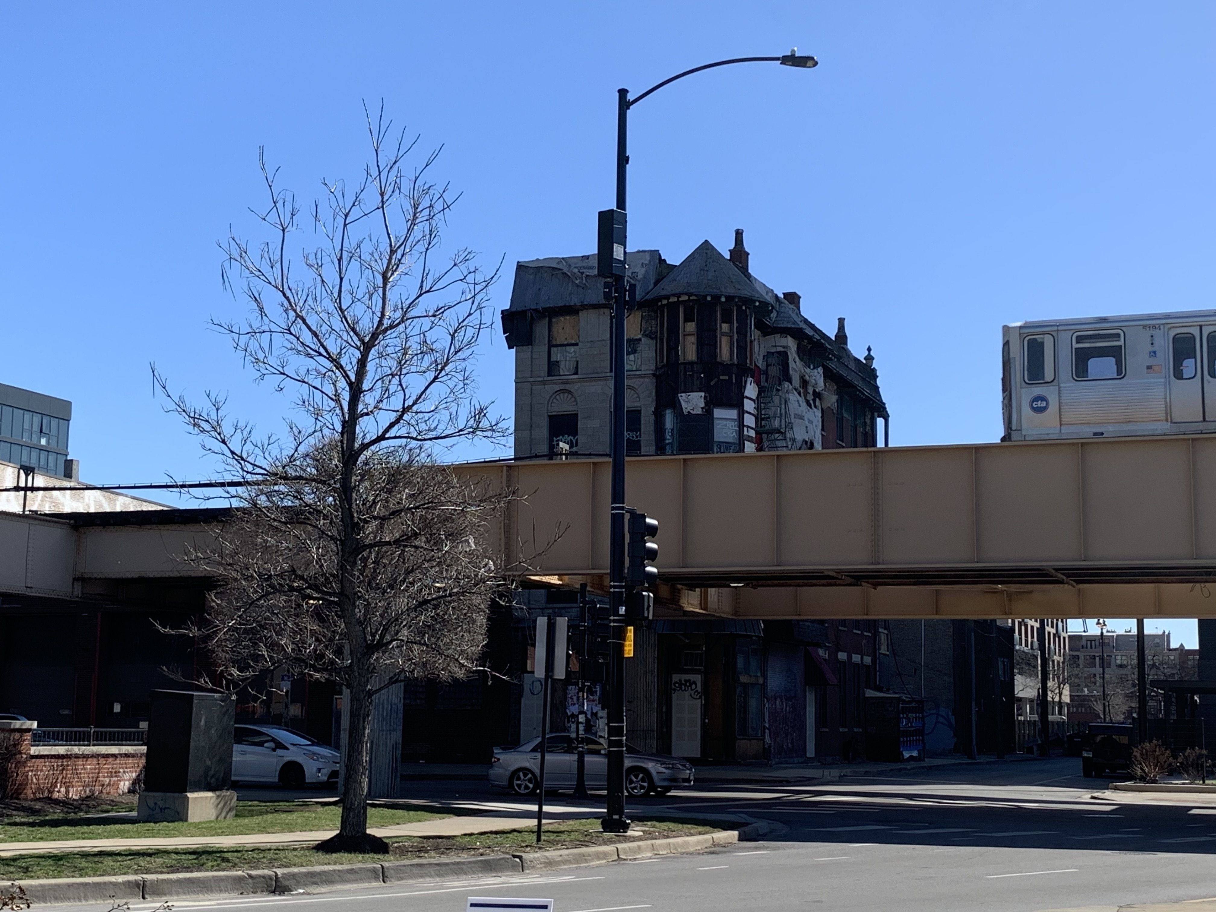 Photo of a building behind a train 