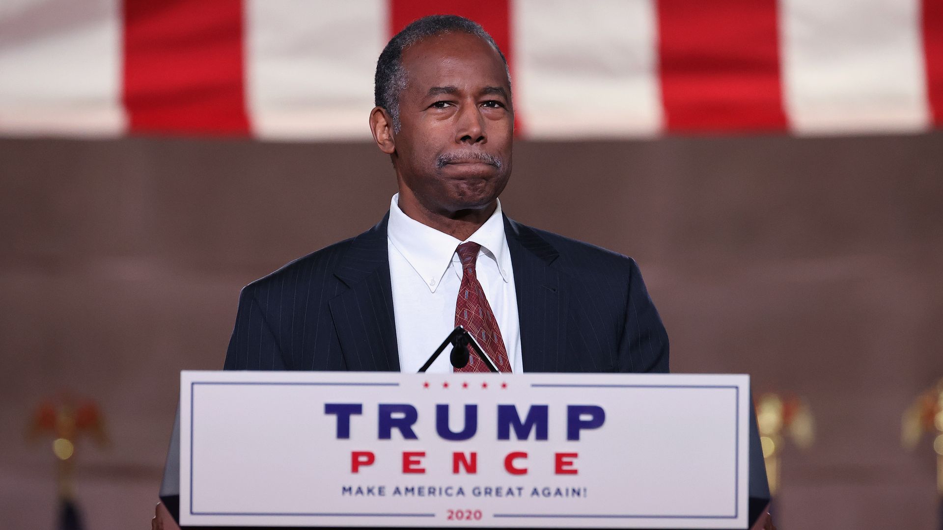 Photo of Ben Carson standing at the podium speaking at a Trump/Pence event