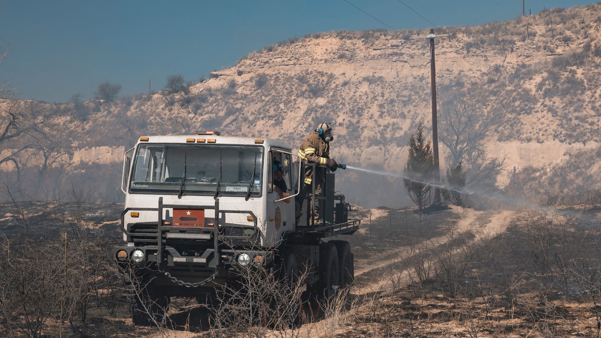 A firefighter works to extinguish a blaze in the Texas Panhandle.
