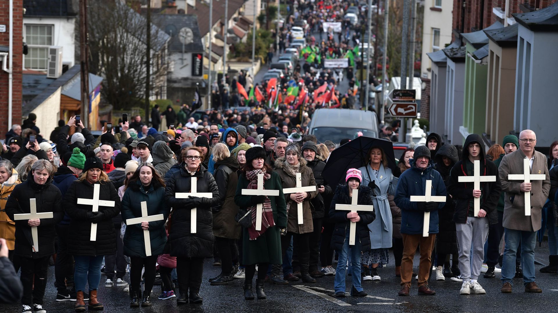 Families of the victims and supporters hold crosses as they take part in Bloody Sunday March to Free Derry Corner, as they mark the 50th Anniversary of Bloody Sunday.