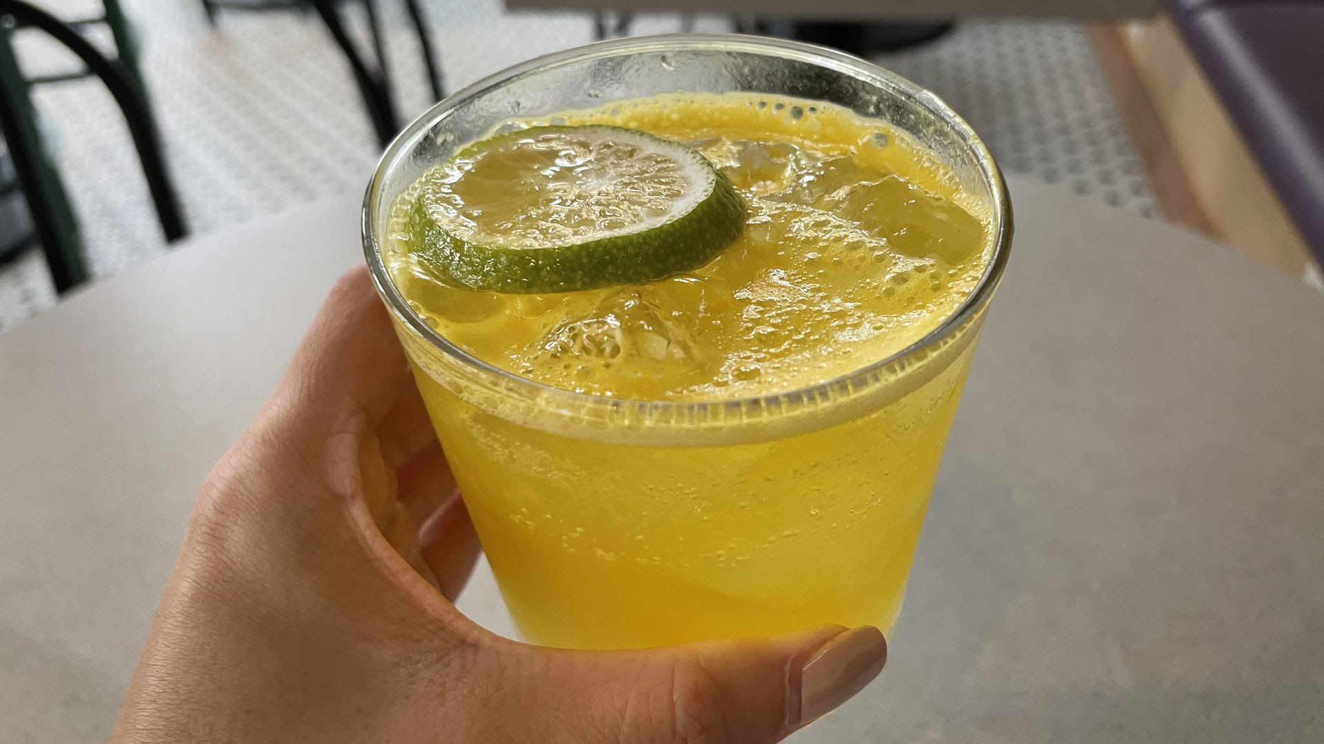 The Secret Spritz, a non-alcoholic beverage with turmeric, yellow bell pepper and orange zest.