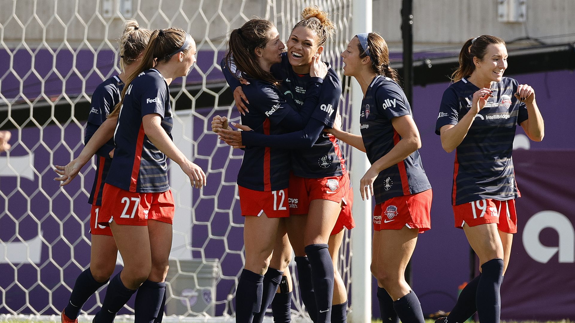 Andi Sullivan #12 of Washington Spirit (C) celebrates with Trinity Rodman #2 after scoring during the second half against Chicago Red Stars.