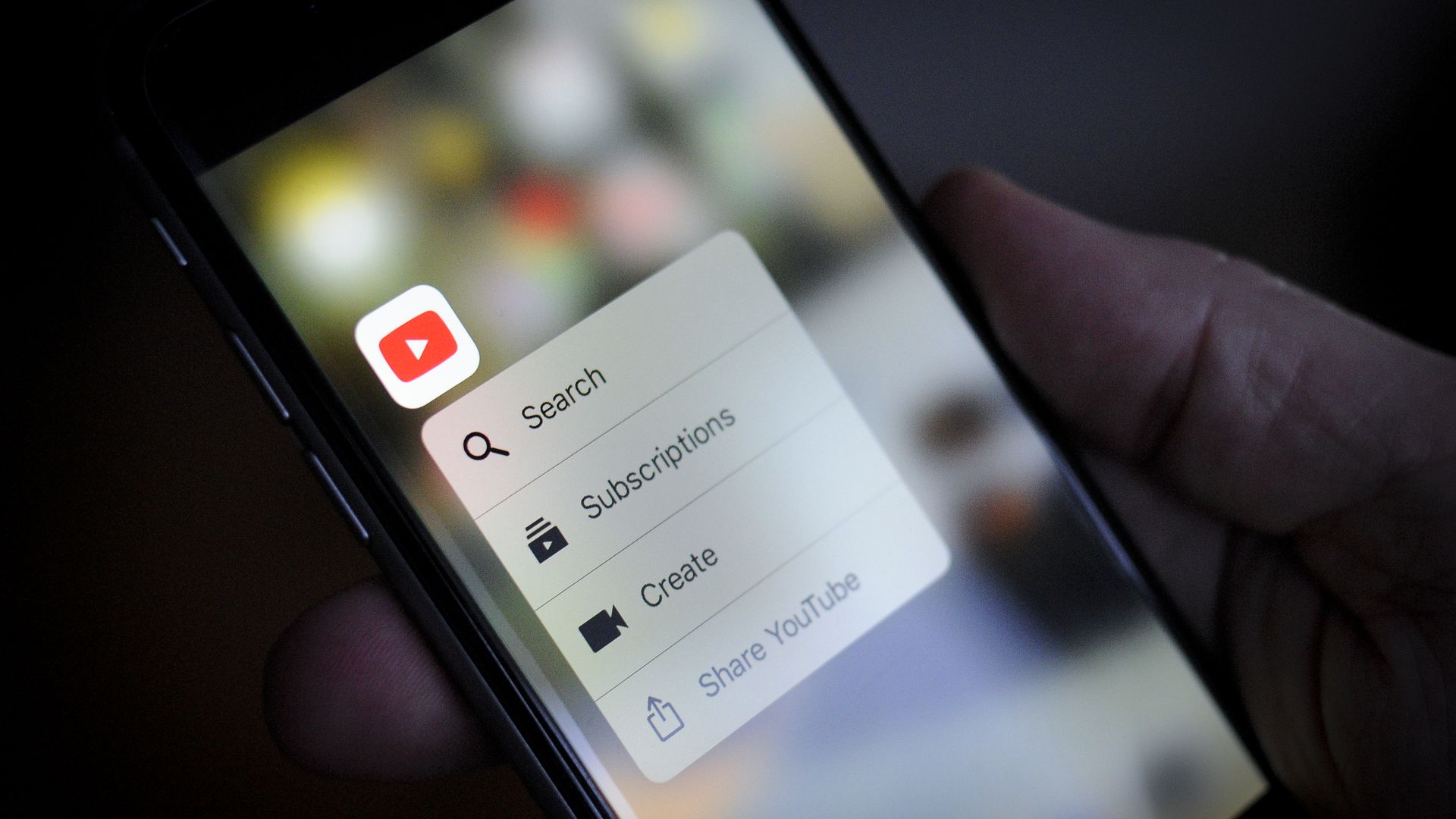 A user opens the YouTube app on a smartphone