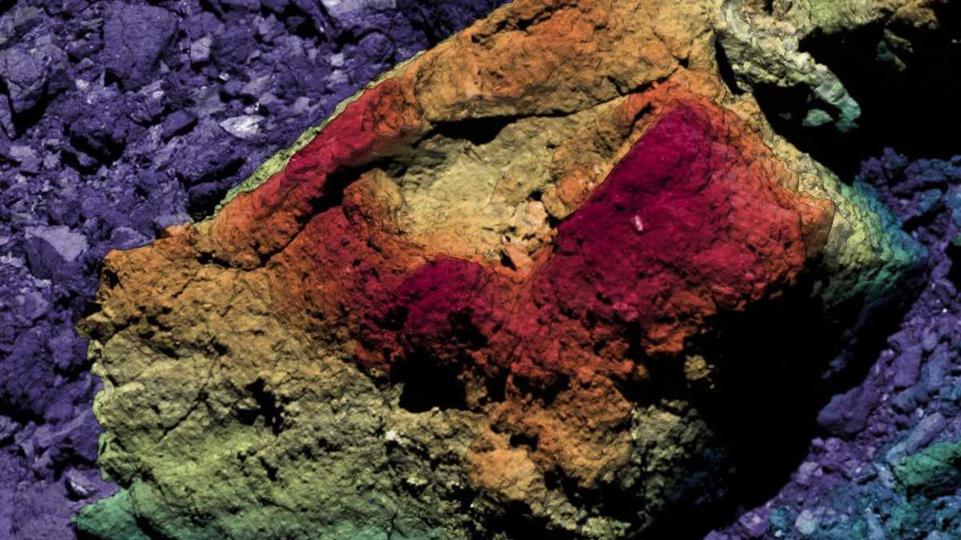 A colorized image of a boulder on asteroid Bennu to show topography.