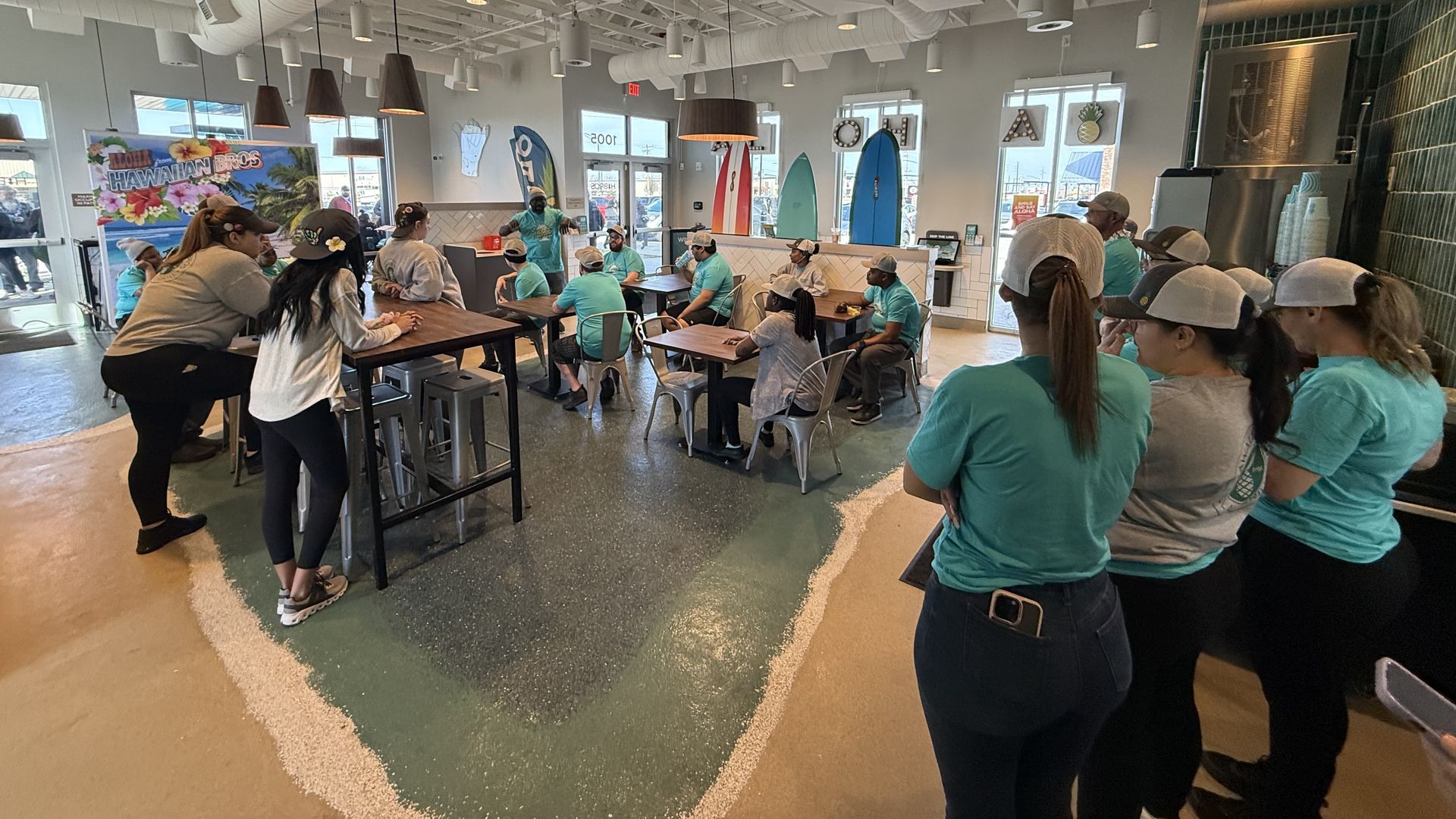 The lobby of Hawaiian Bros in Waukee with customers sitting inside