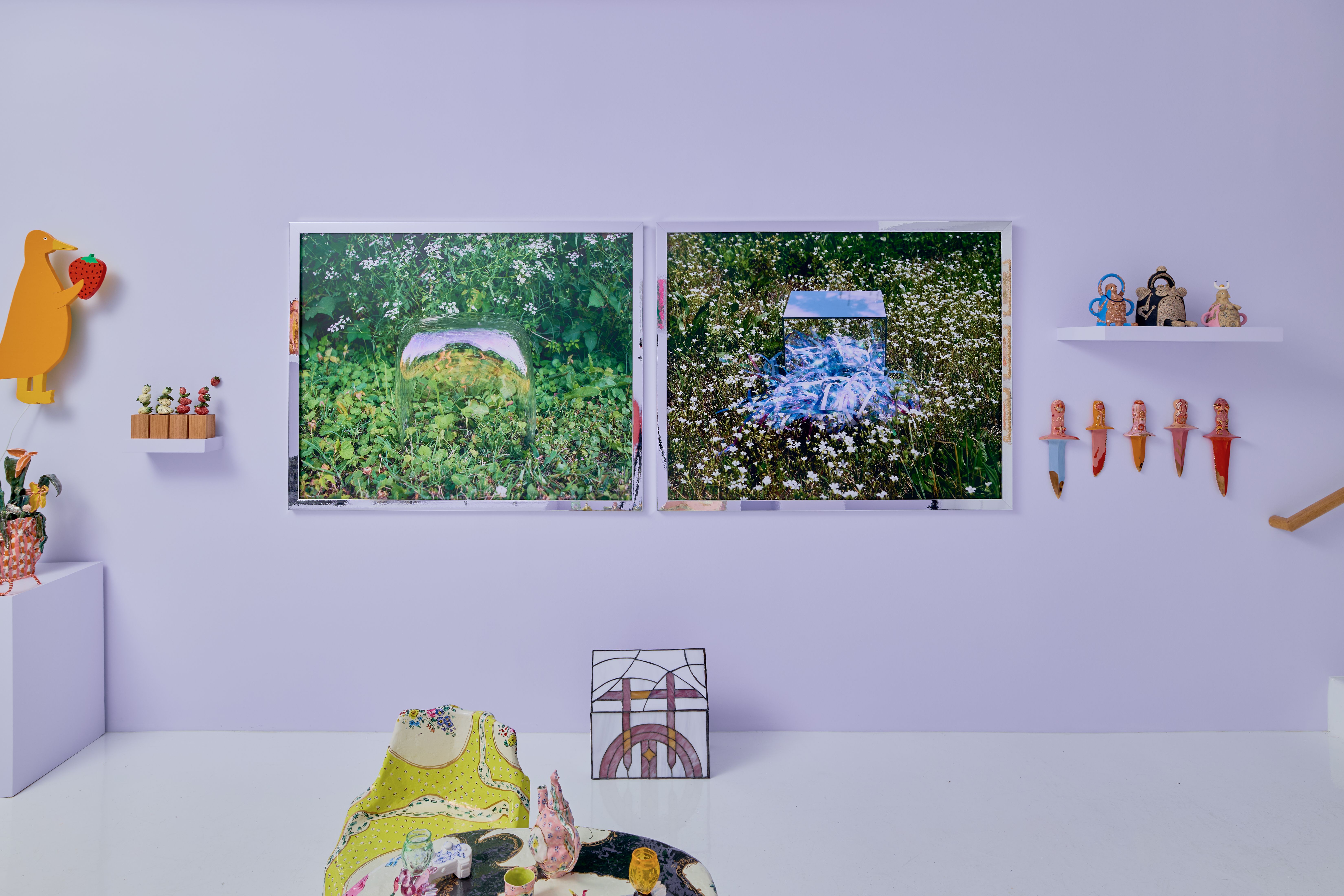 A photo showing an art gallery filled with unusual, child-like art.