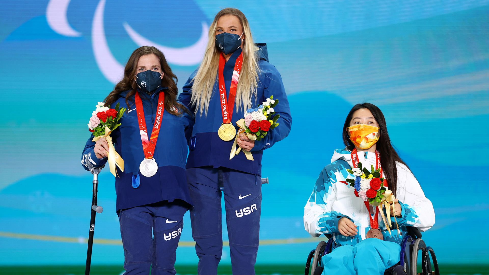 Picture of Kendall Gretsch, Oksana Masters and Yilin Shan receiving their medals