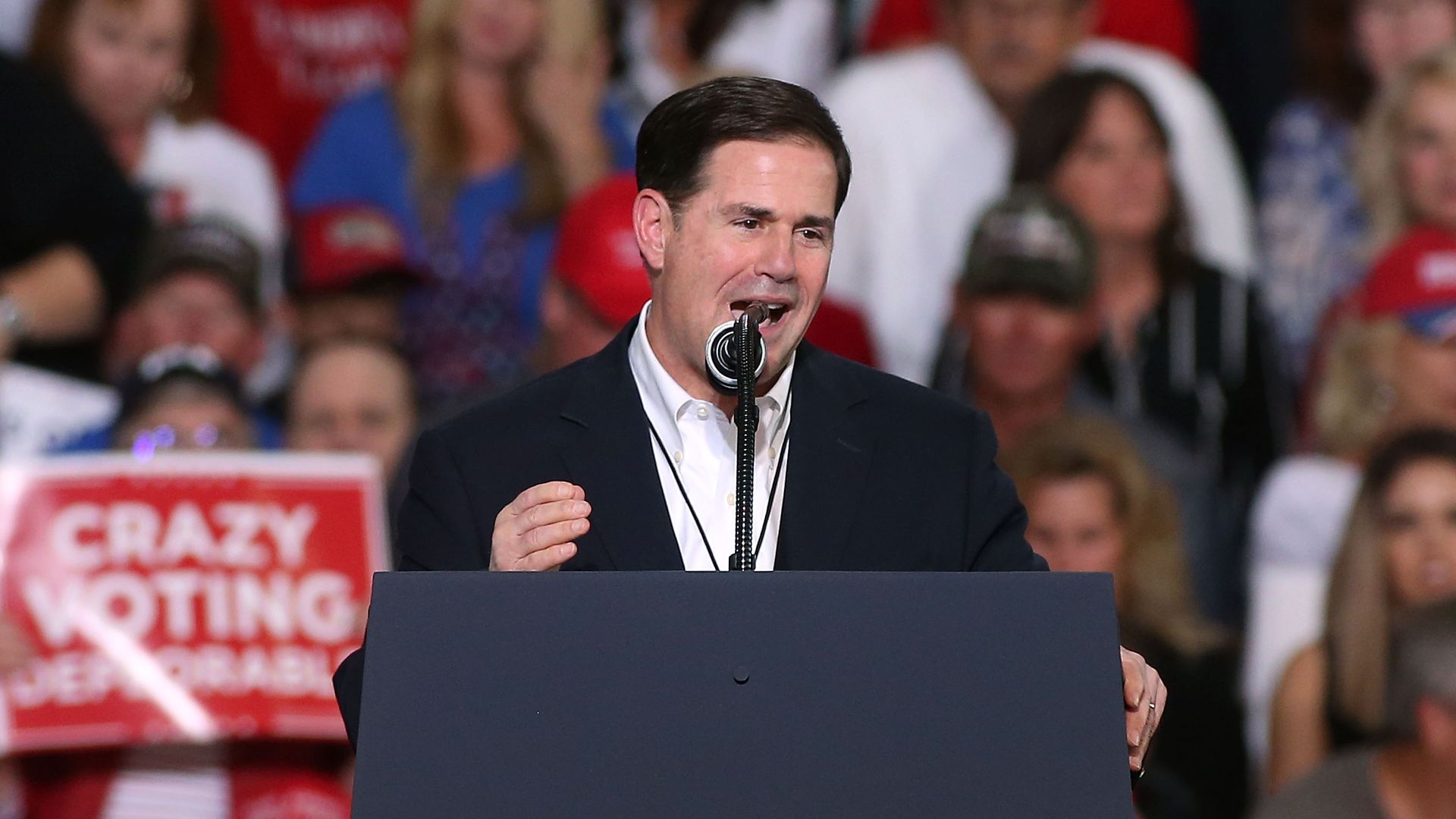 Arizona Gov. Doug Ducey speaks during a rally for President Donald Trump at the International Air Response facility on October 19, 2018 in Mesa, Arizona.