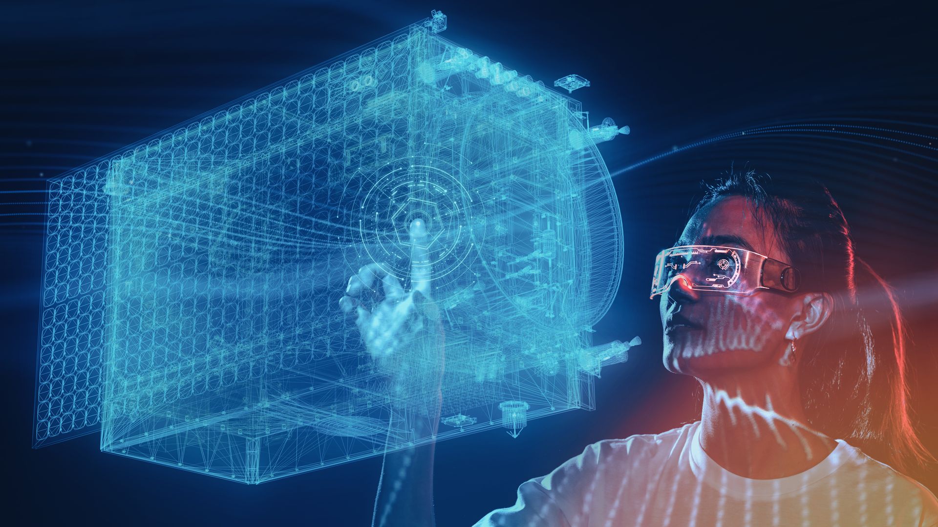 A woman wearing goggles touching a digital rendering of a blue cube. 