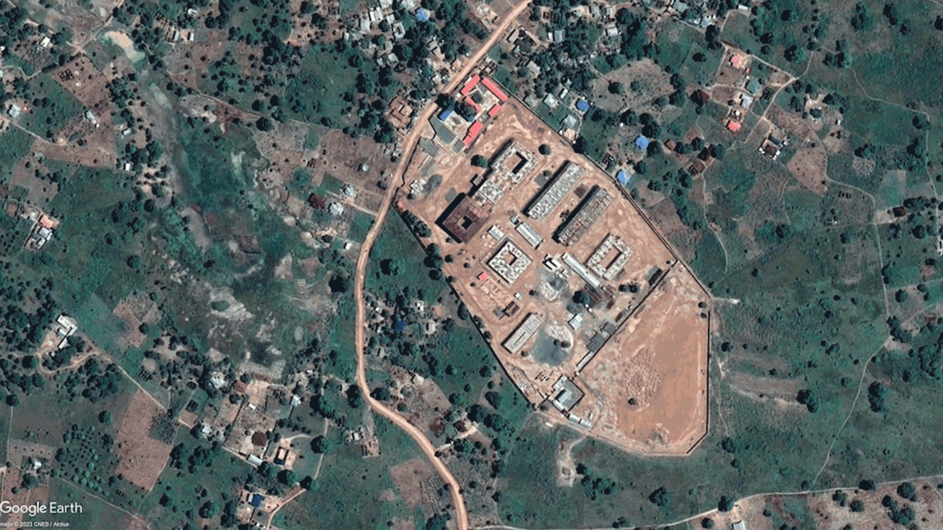 A gif of satellite imagery from 2015 showing mostly undeveloped land transitioning to the same land in 2019 built up and under construction.