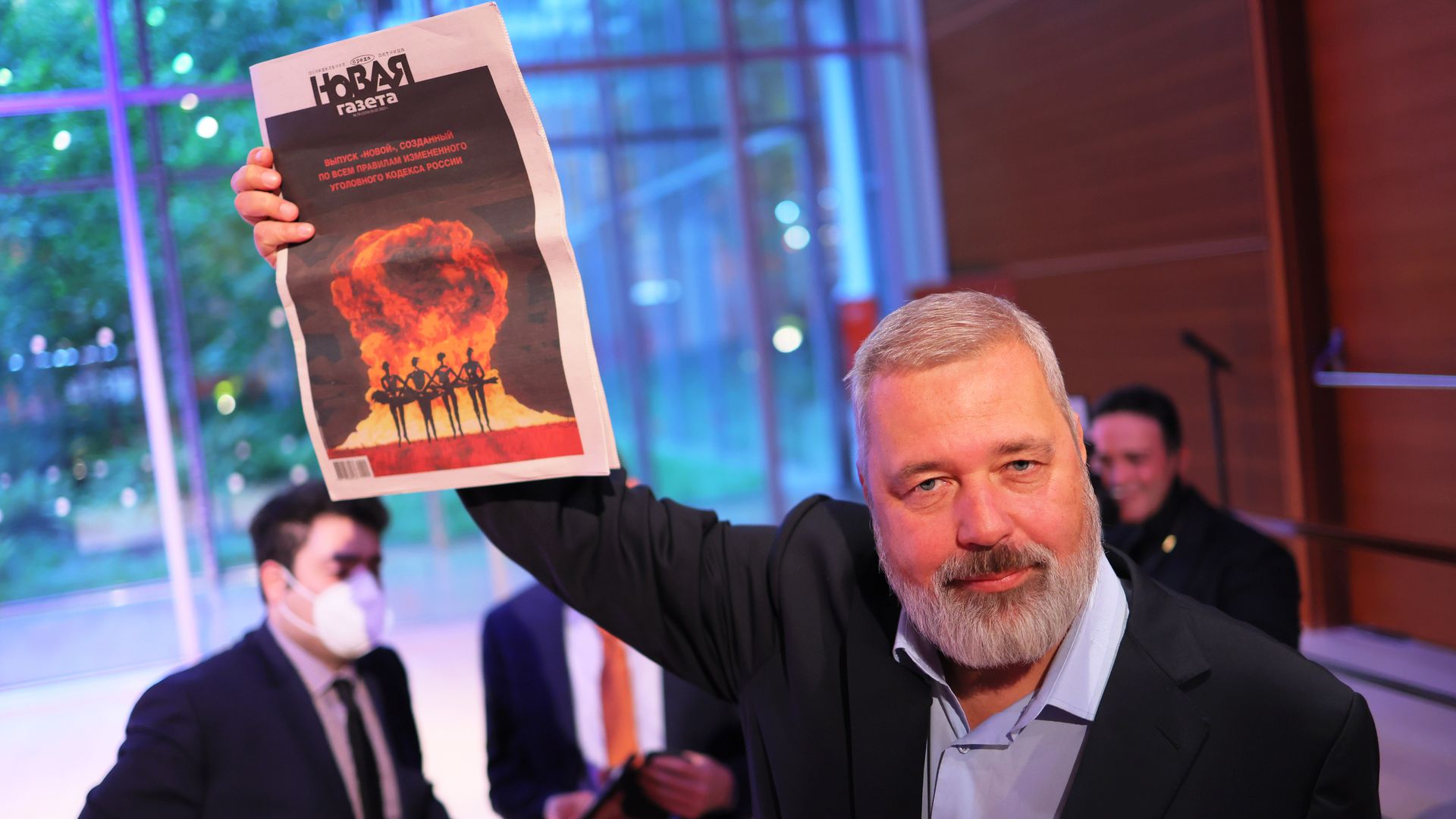Nobel Peace Prize winner Dmitry Muratov holds up a copy of his Russian newspaper Novaya Gazeta fter the conclusion of a charity auction on June 20 in New York City. 