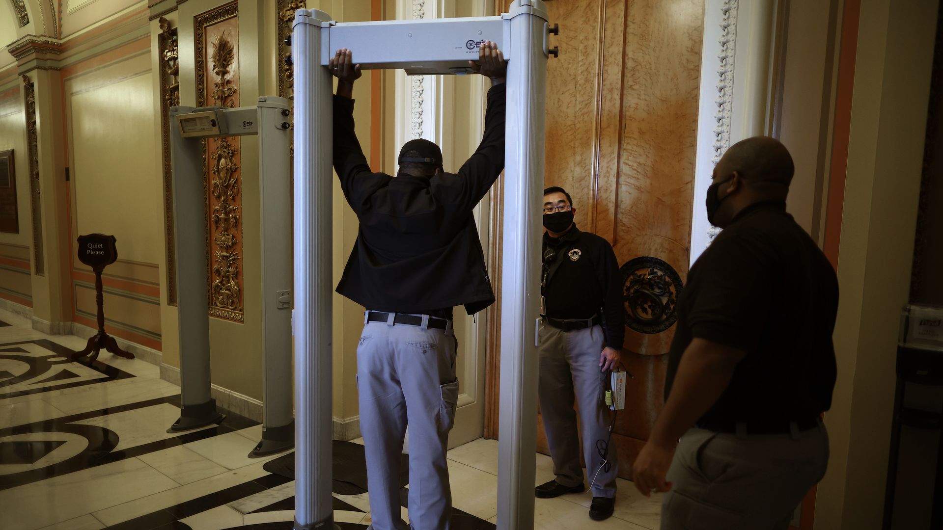 U.S. Capitol Police install a metal detector outside the doors of the House of Representatives on Jan. 12.