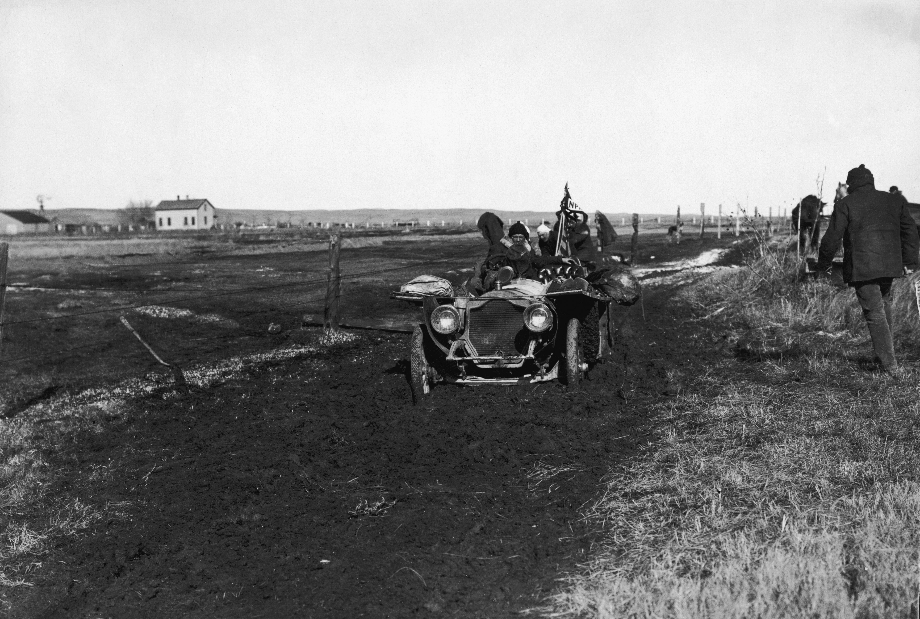 car stuck in the mud during 1908 race around the world