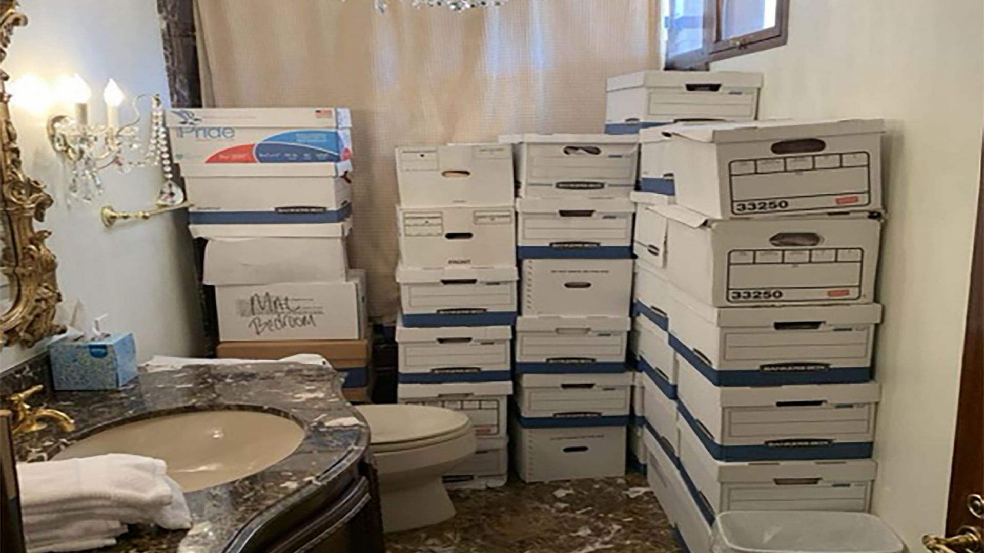  In this handout photo provided by the U.S. Department of Justice, stacks of boxes can be observed in a bathroom and shower in The Mar-a-Lago Club’s Lake Room 