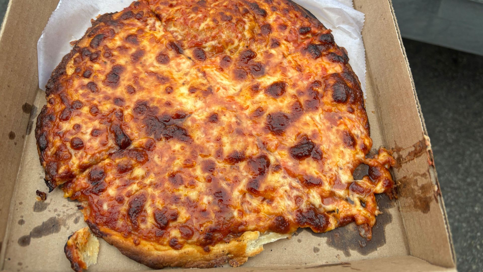 Jioio's original pizza with molten cheese toped over a sweet pastry crust