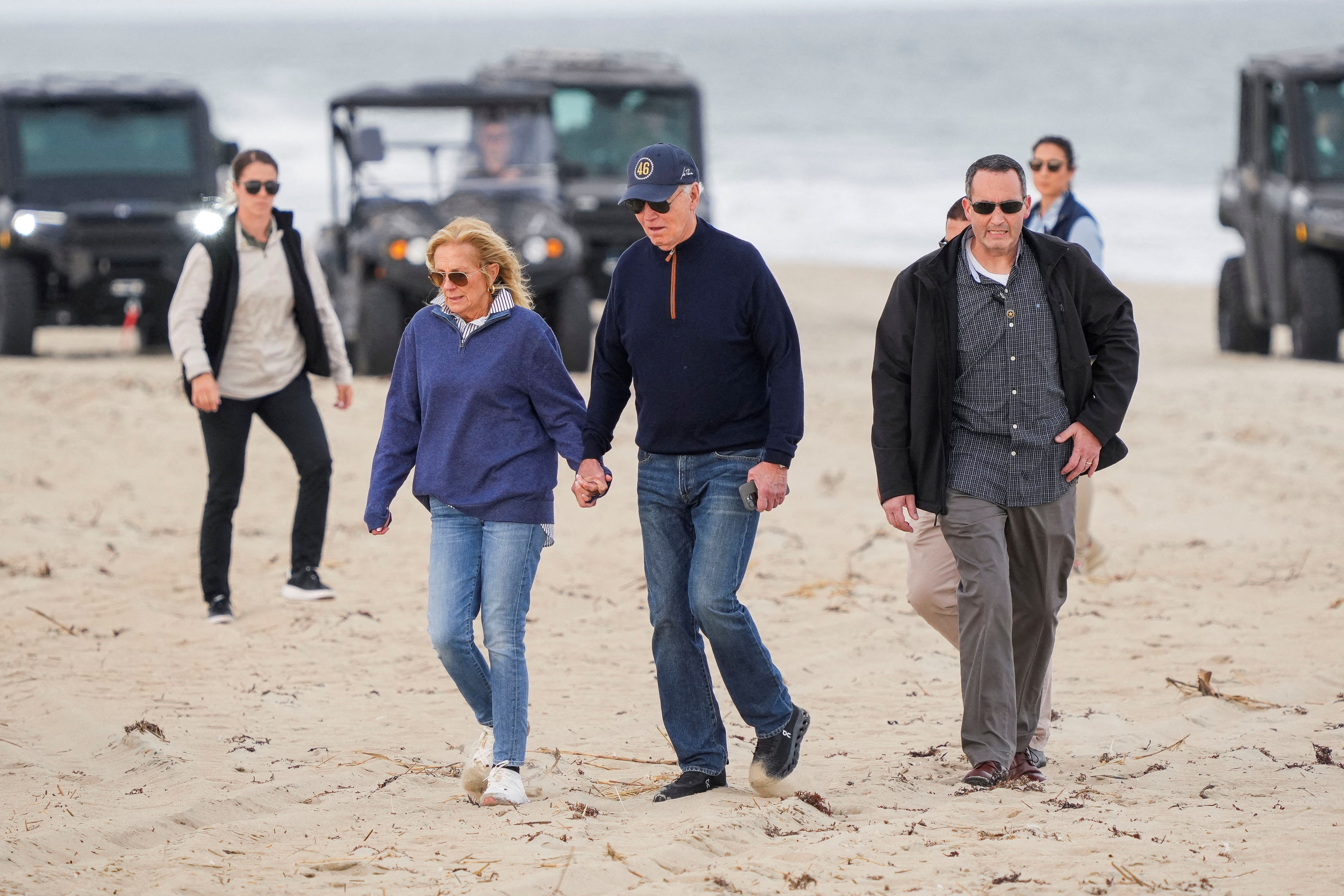 President Biden and First Lady Jill Biden walk on the seashore in Rehoboth Beach yesterday.