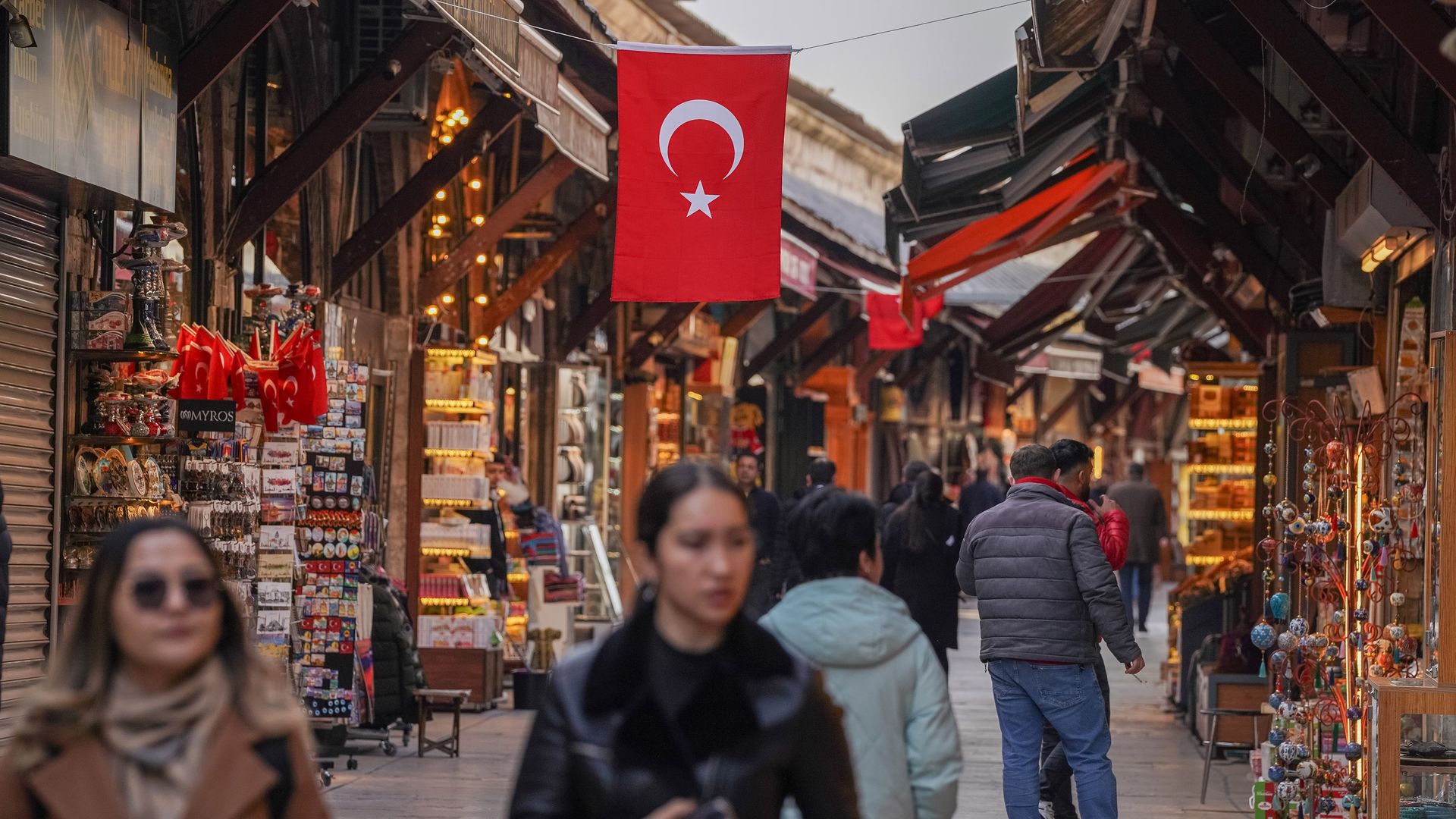 A marketplace in Turkey, showing the Turkish flag above a stall. 
