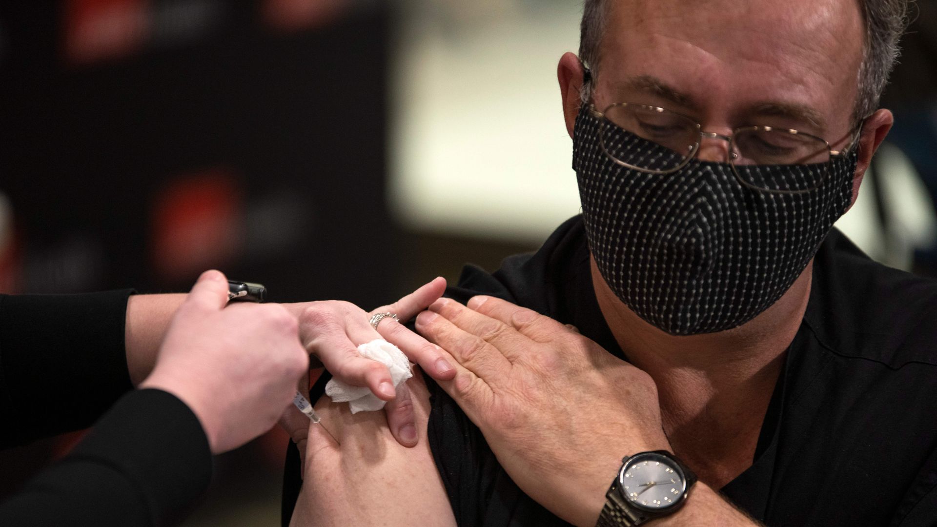 Man receives a Covid-19 vaccine