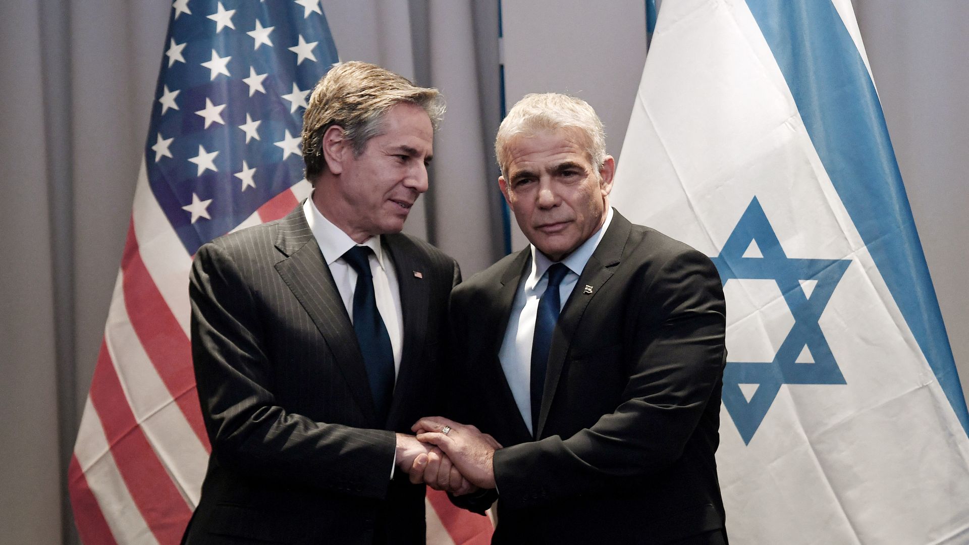 US Secretary of State Antony Blinken (L) meets with Israeli Foreign Minister Yair Lapid in Riga, Latvia on March 7, 2022. 