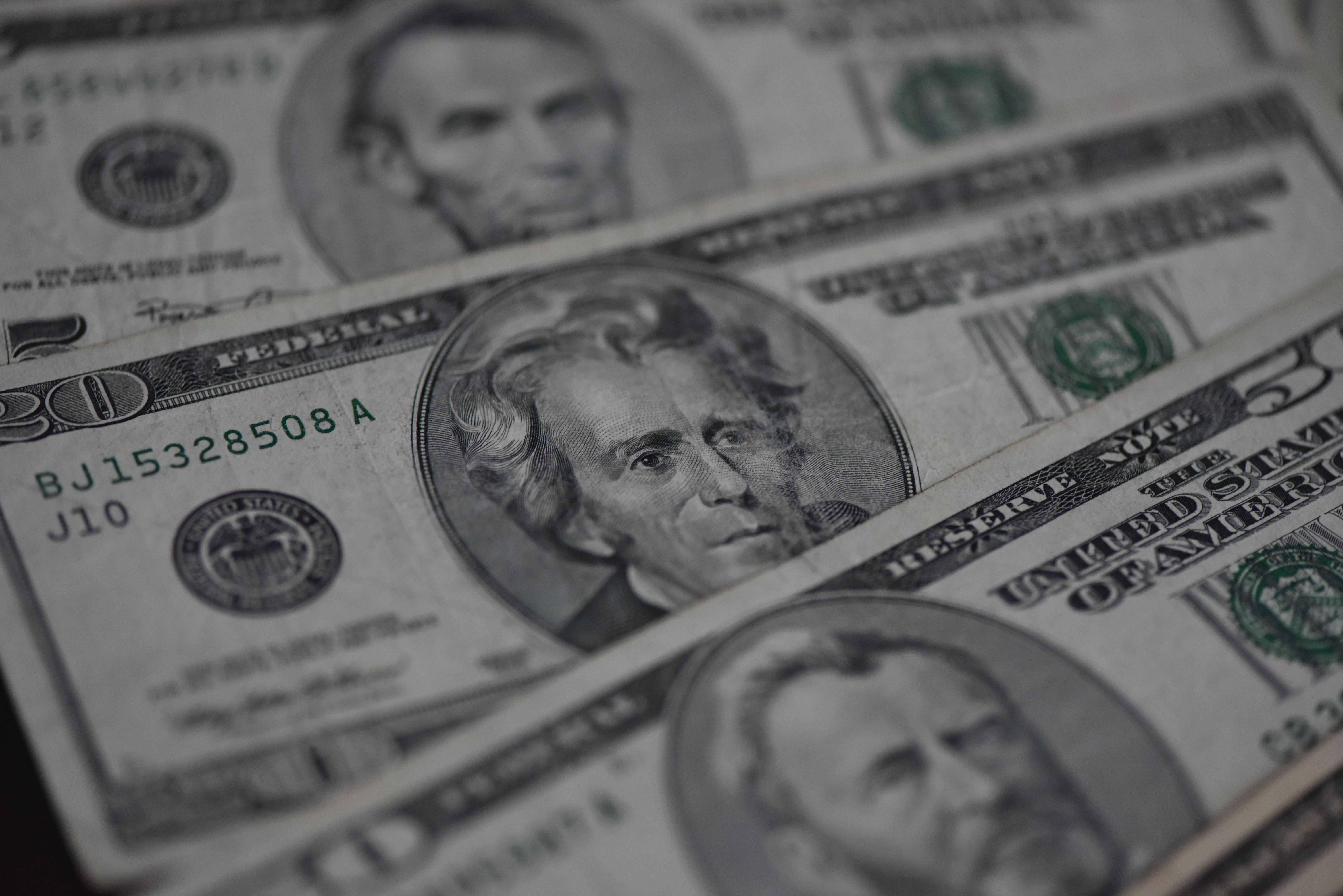 A close-up of U.S. dollar bills arranged in a spread, photographed in Fuyang, China.