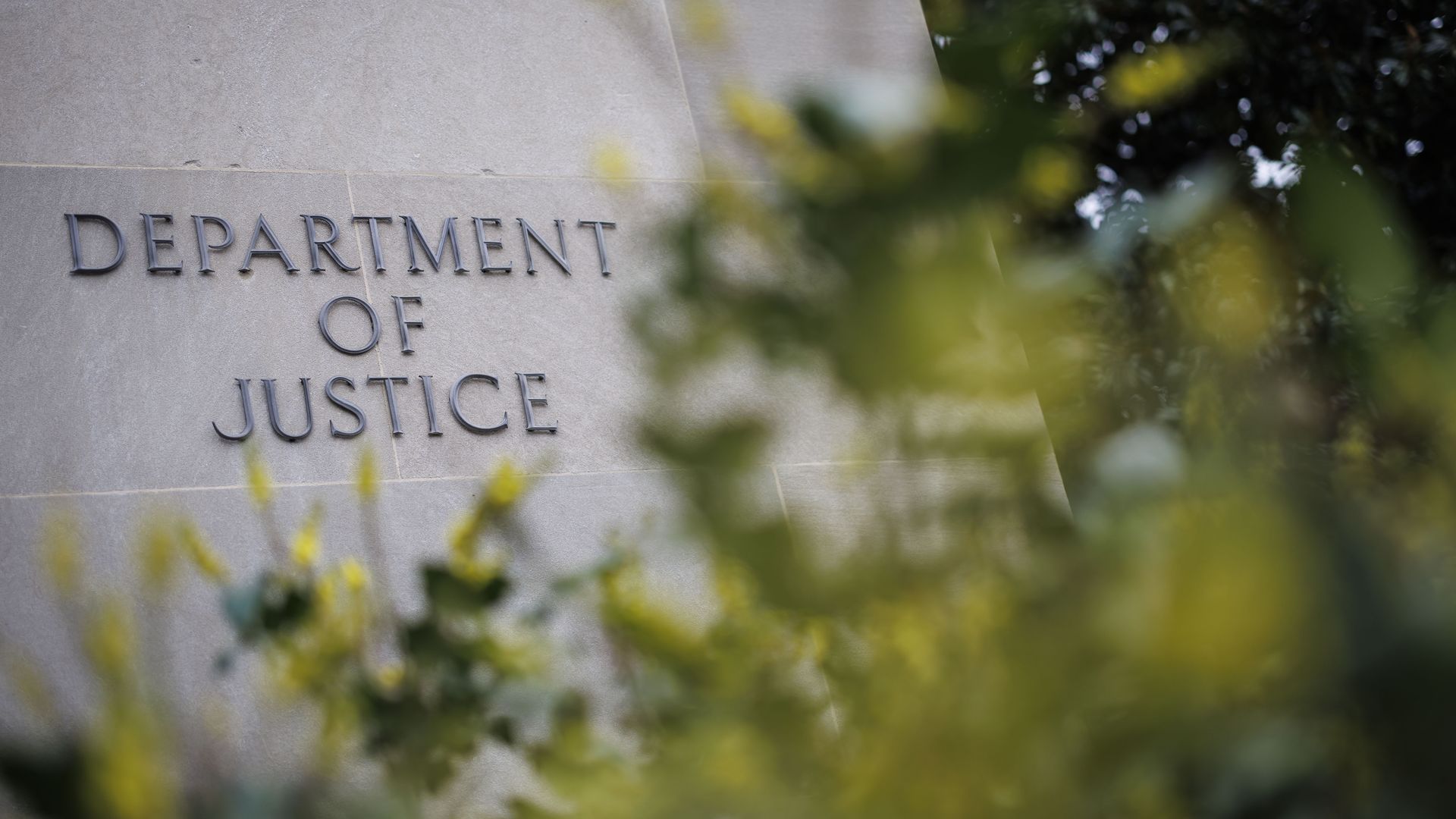 Signage outside the US Department of Justice (DOJ) headquarters in Washington, DC, US, on Friday, Feb. 17, 2023. 