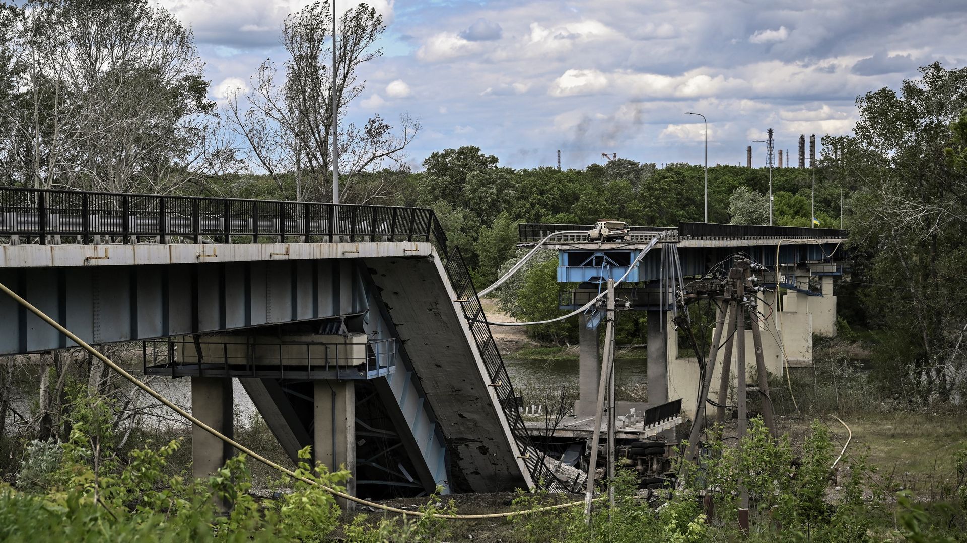 A picture taken on May 22, 2022, shows the destroyed bridge connecting the city of Lysychansk with the city of Severodonetsk in the eastern Ukranian region of Donbas.