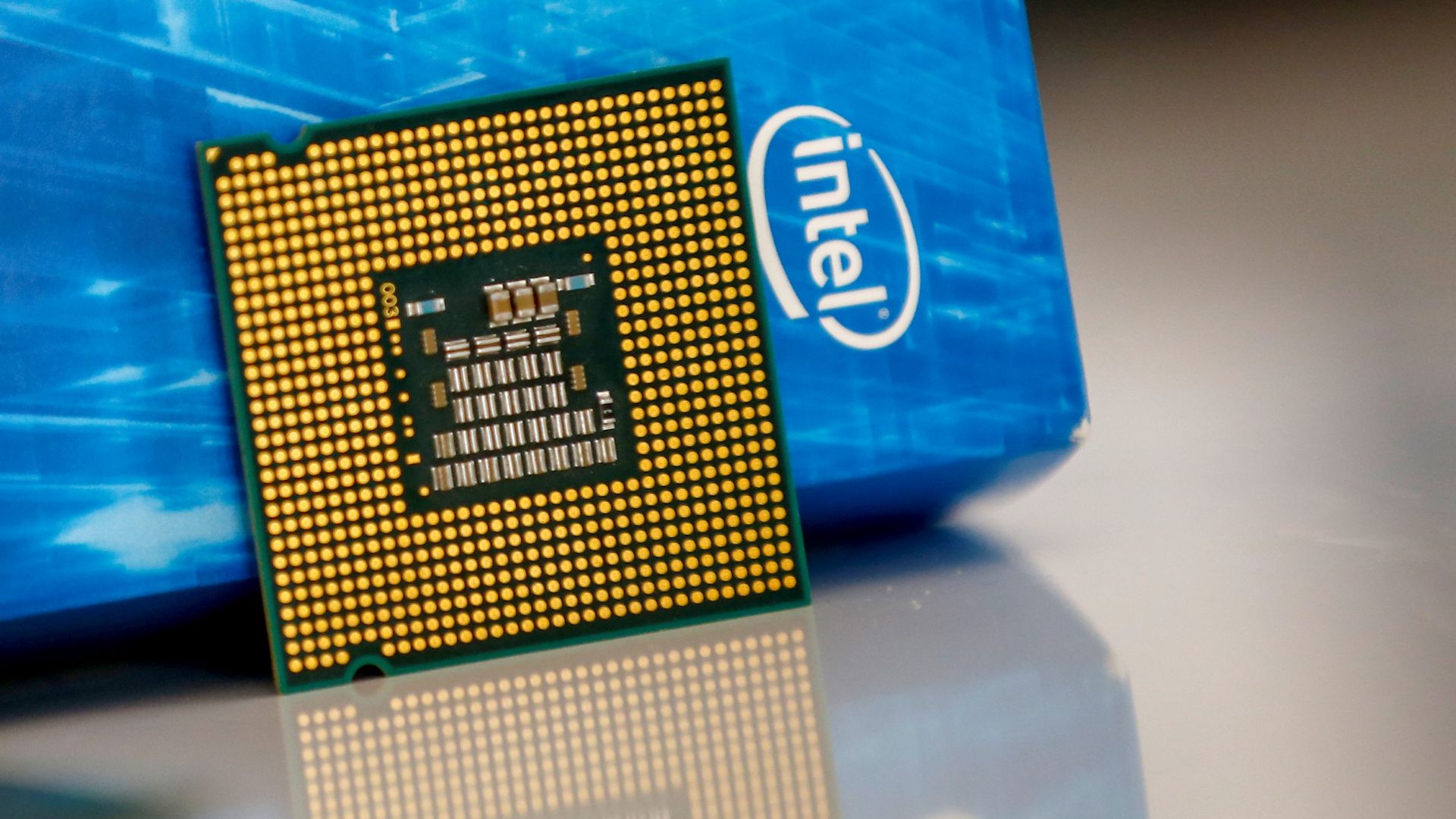 The Intel logo and a processor chip in a photo.