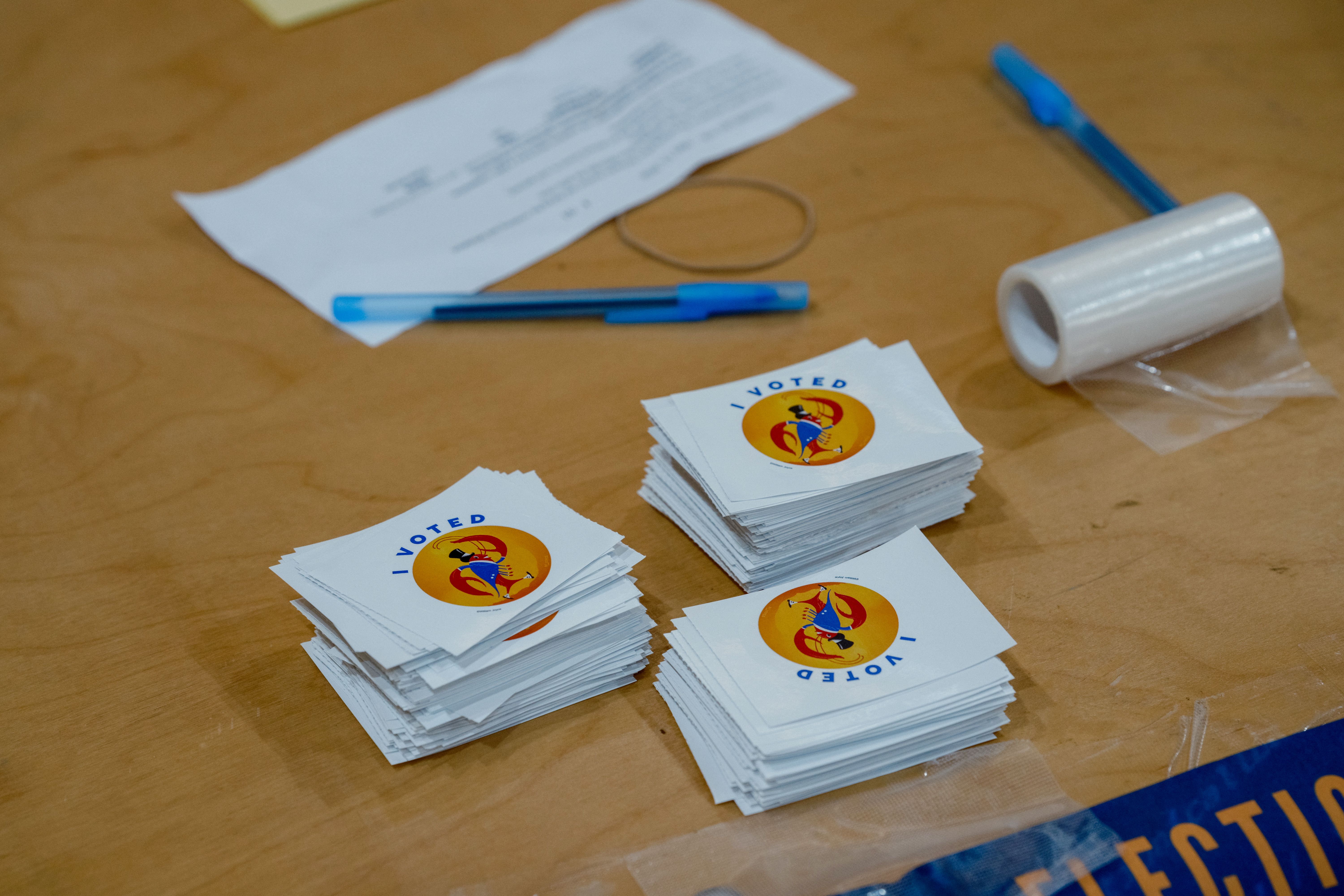 Image shows "I Voted" stickers with a crawfish on them.
