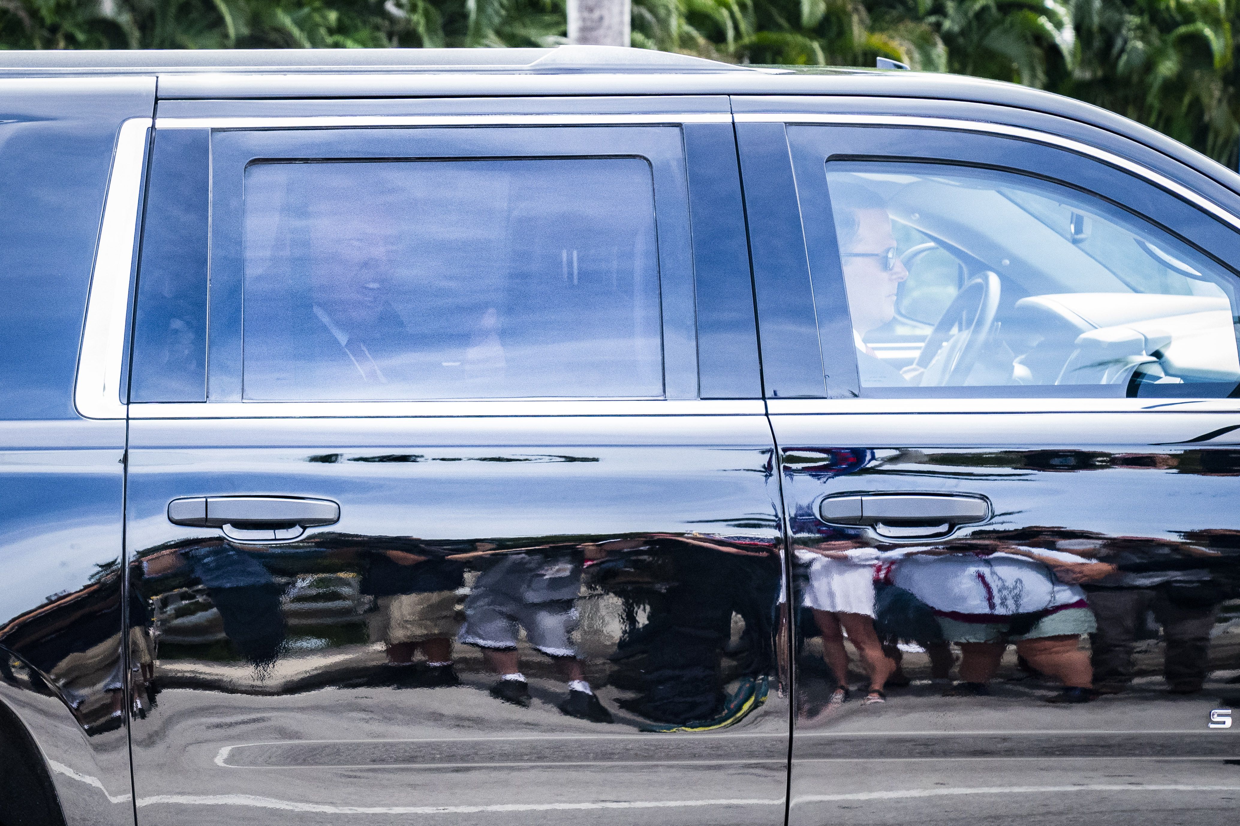 A motorcade carrying former President Donald Trump arrives at his Trump National Doral resort on June 12, in Doral, Florida. 
