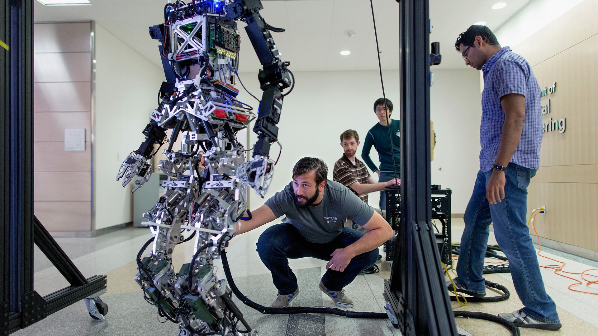 Students tinker with a robot