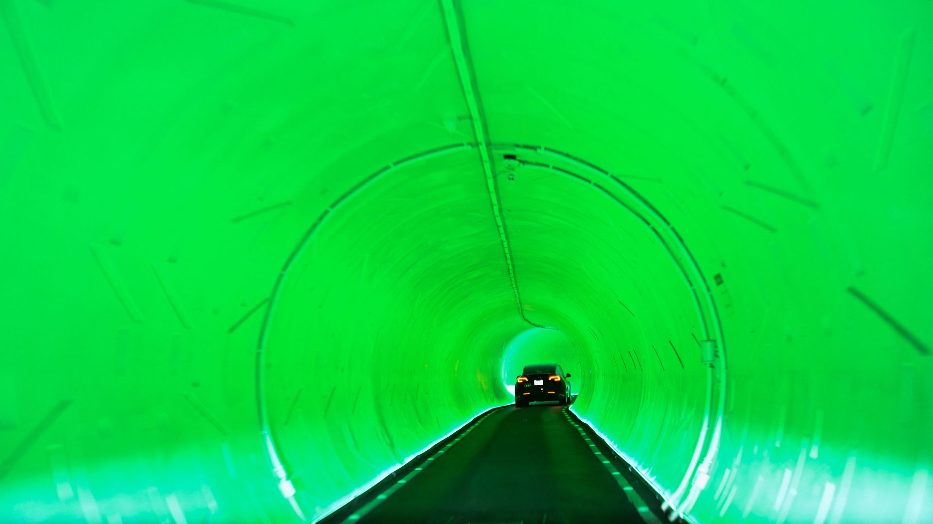 A Tesla Inc. electric vehicle drives through a tunnel in the Boring Company's Las Vegas Convention Center Loop.