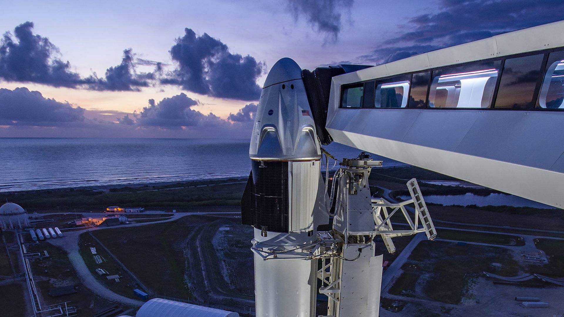SpaceX's Crew Dragon stands atop a Falcon 9 rocket ahead of launch