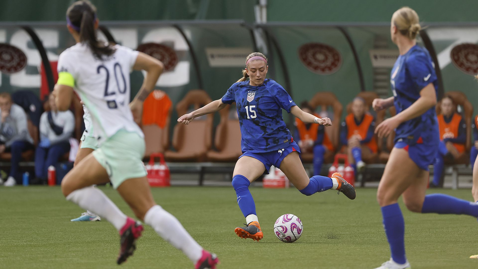 Trinity Byars kicking a ball playing for the Under-23 Women's National Team 