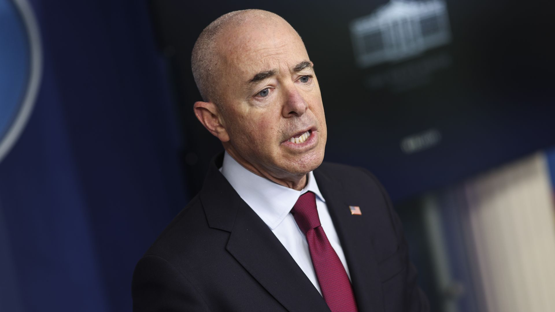 Homeland Security Secretary Alejandro Mayorkas is seen speaking with reporters.