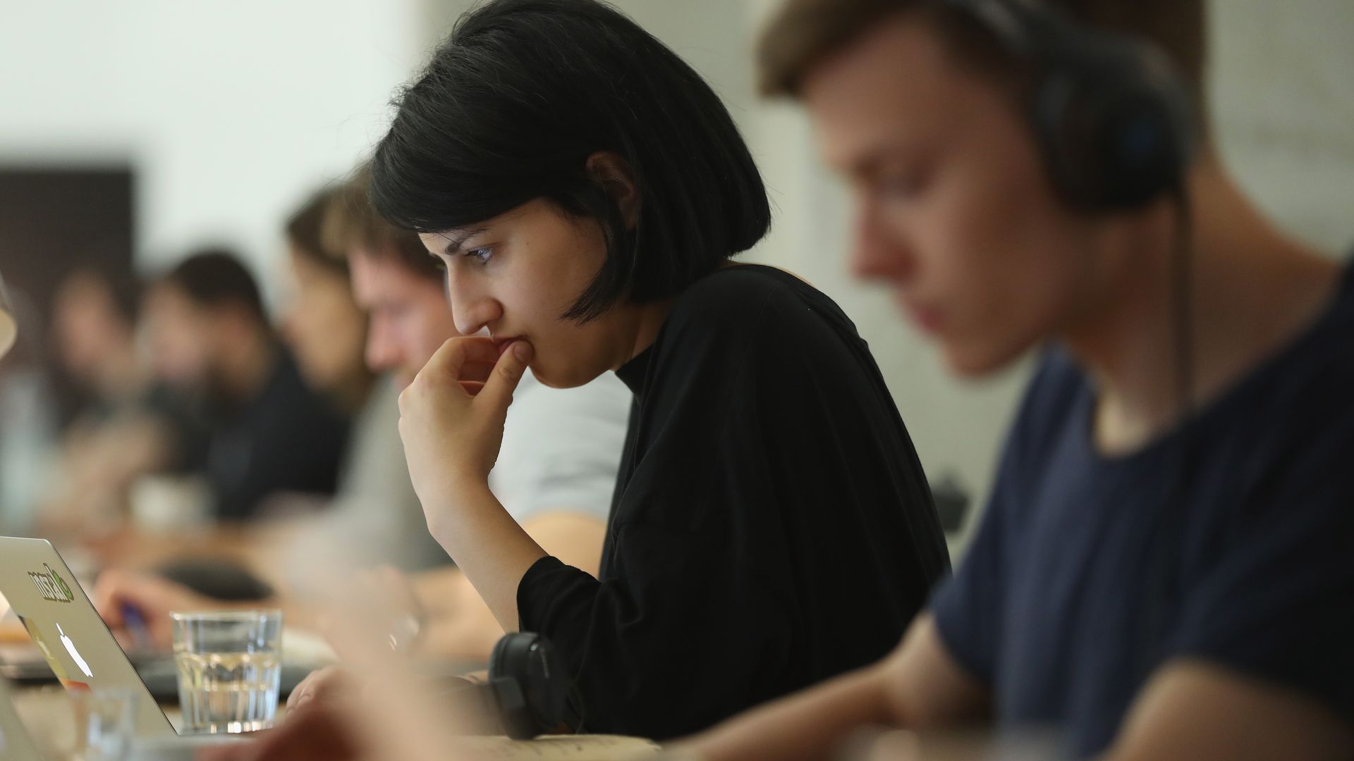 Woman works on computer.